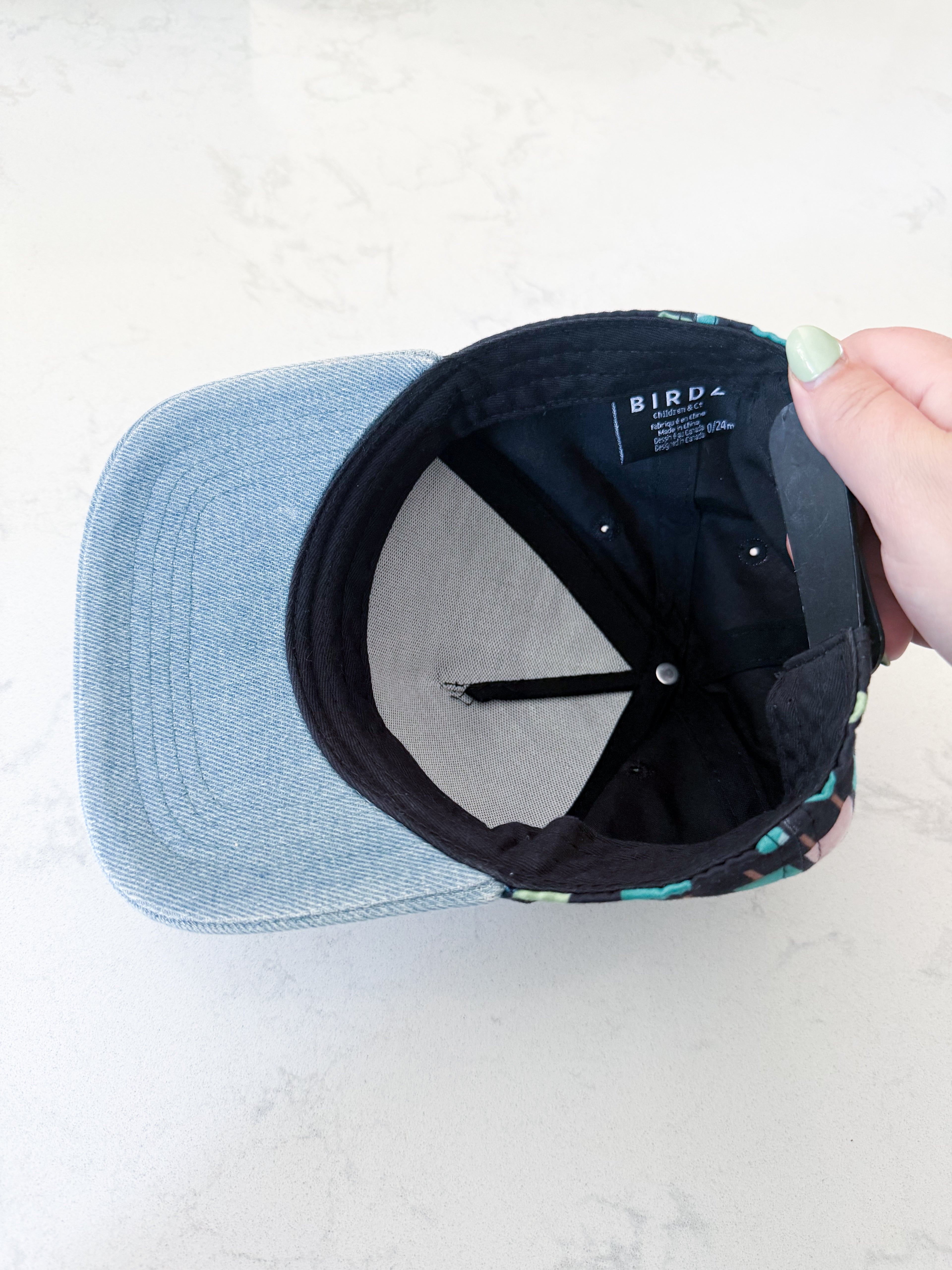 Birdz- 0-24m- GUC- black ball cap with blue brim and popsicle graphic