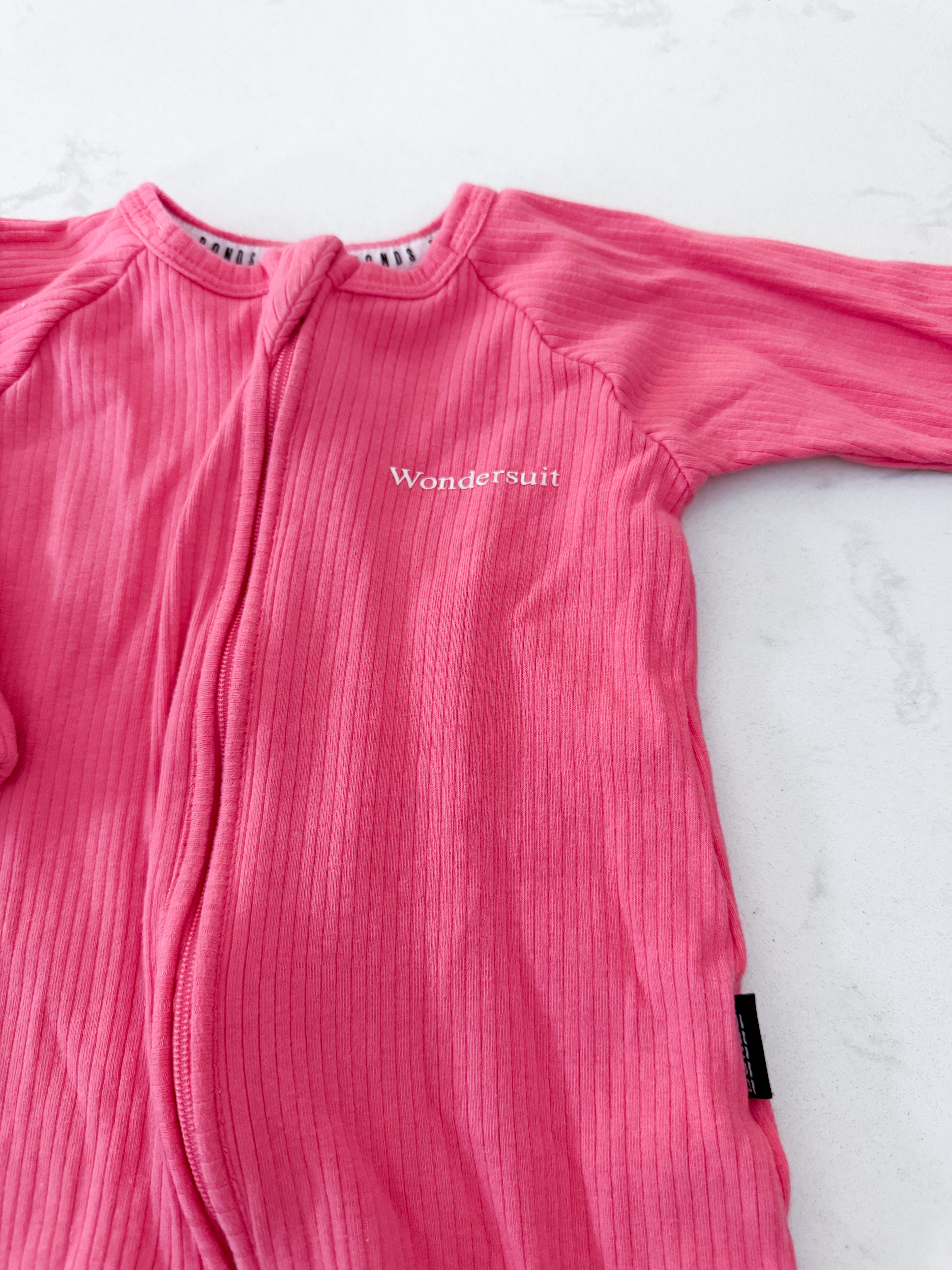 Wondersuit- size 00 (3-6m)- GUC- pink ribbed romper jammies