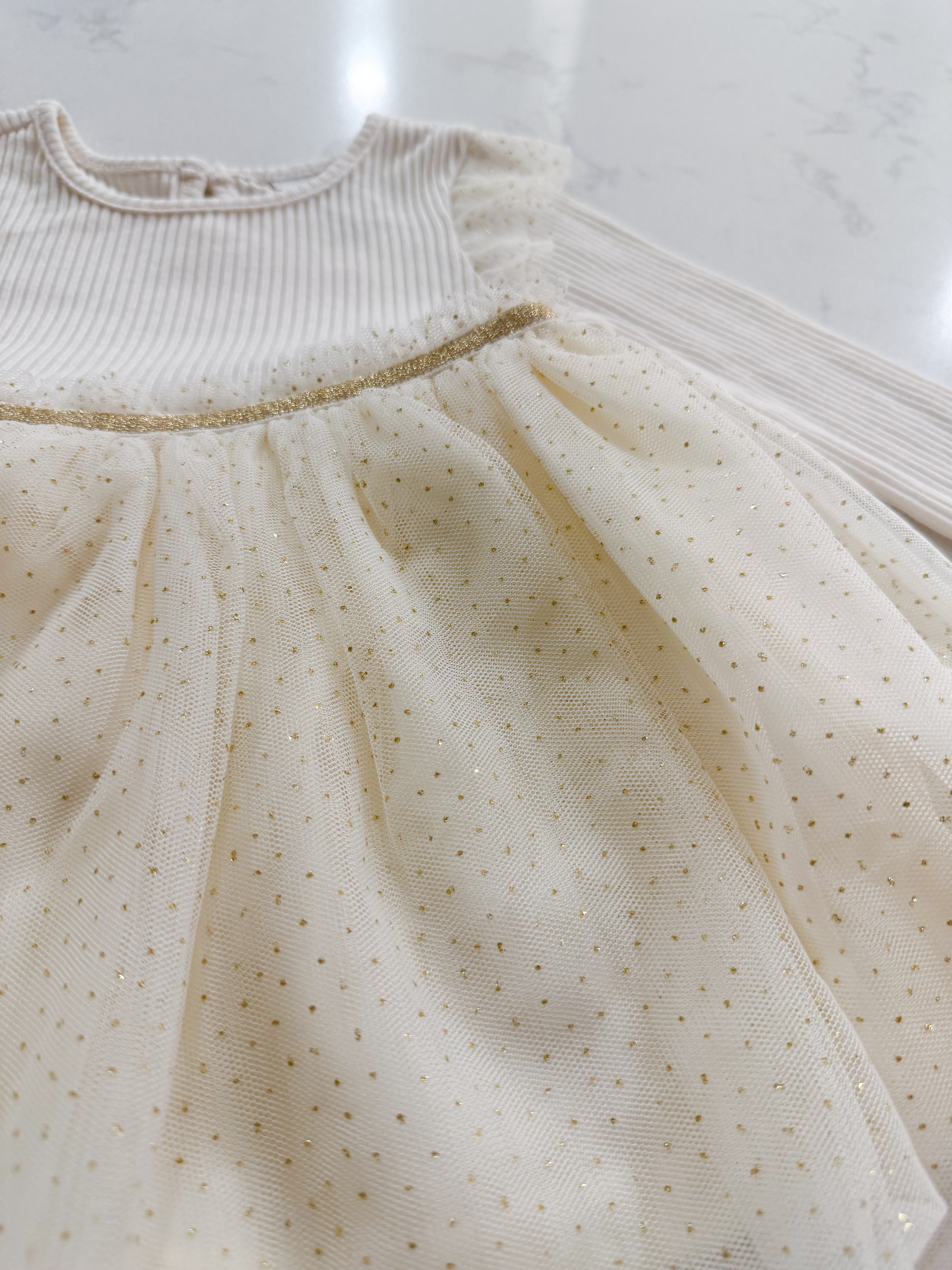 The Children’s Place- 9-12m- VGUC- long sleeve ribbed dress with gold sparkly tulle skirt