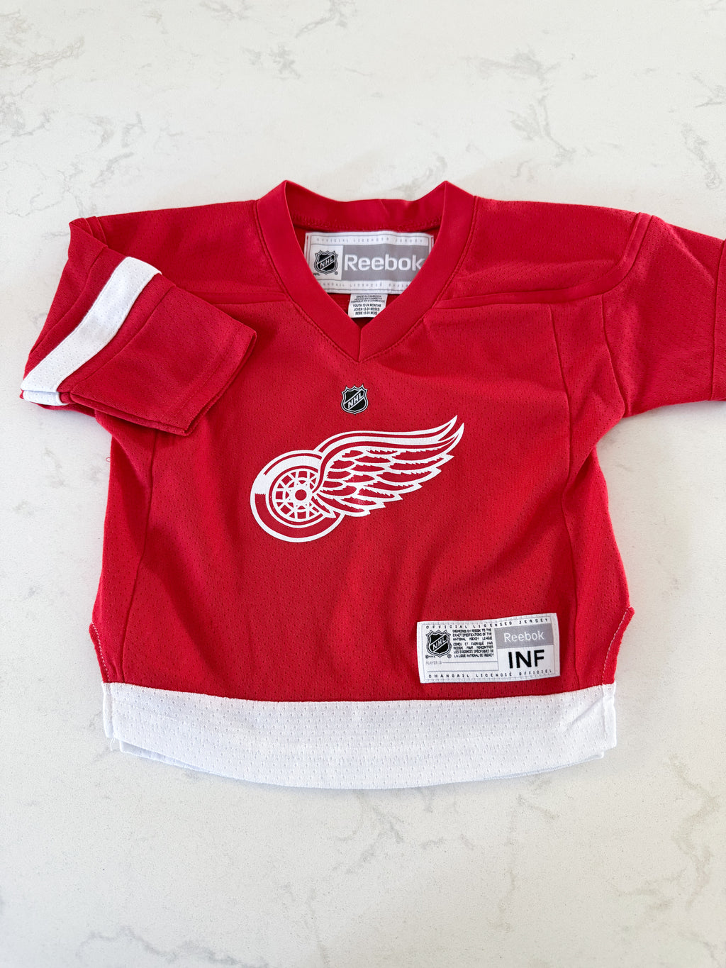 Reebok- 12-24m- VGUC- Detroit red wings hockey jersey