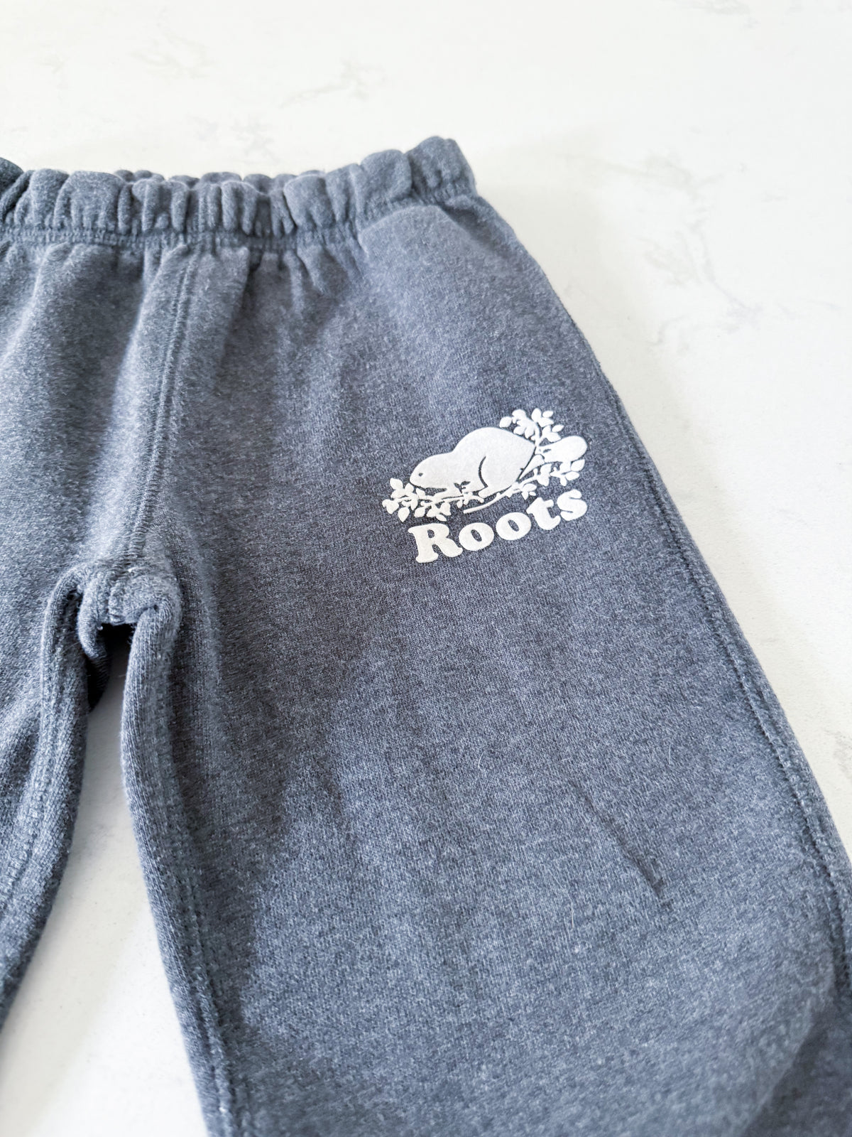 Roots- 4T- GUC- medium grey sweat pants with white logo