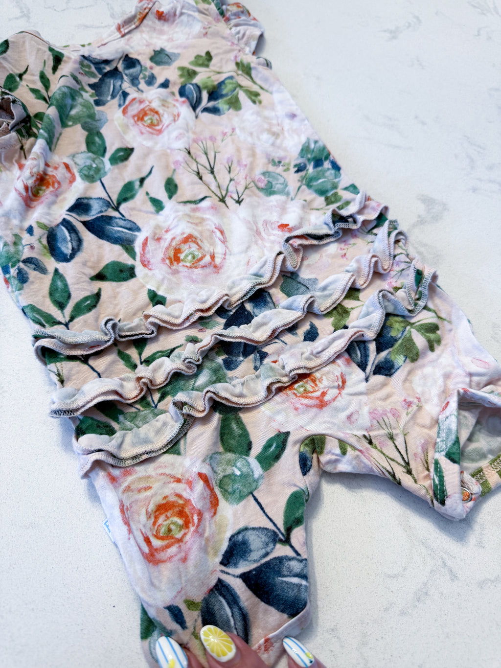 Posh Peanut- 3-6m- VGUC- light pink short sleeve bamboo romper with rose pattern and ruffle bum