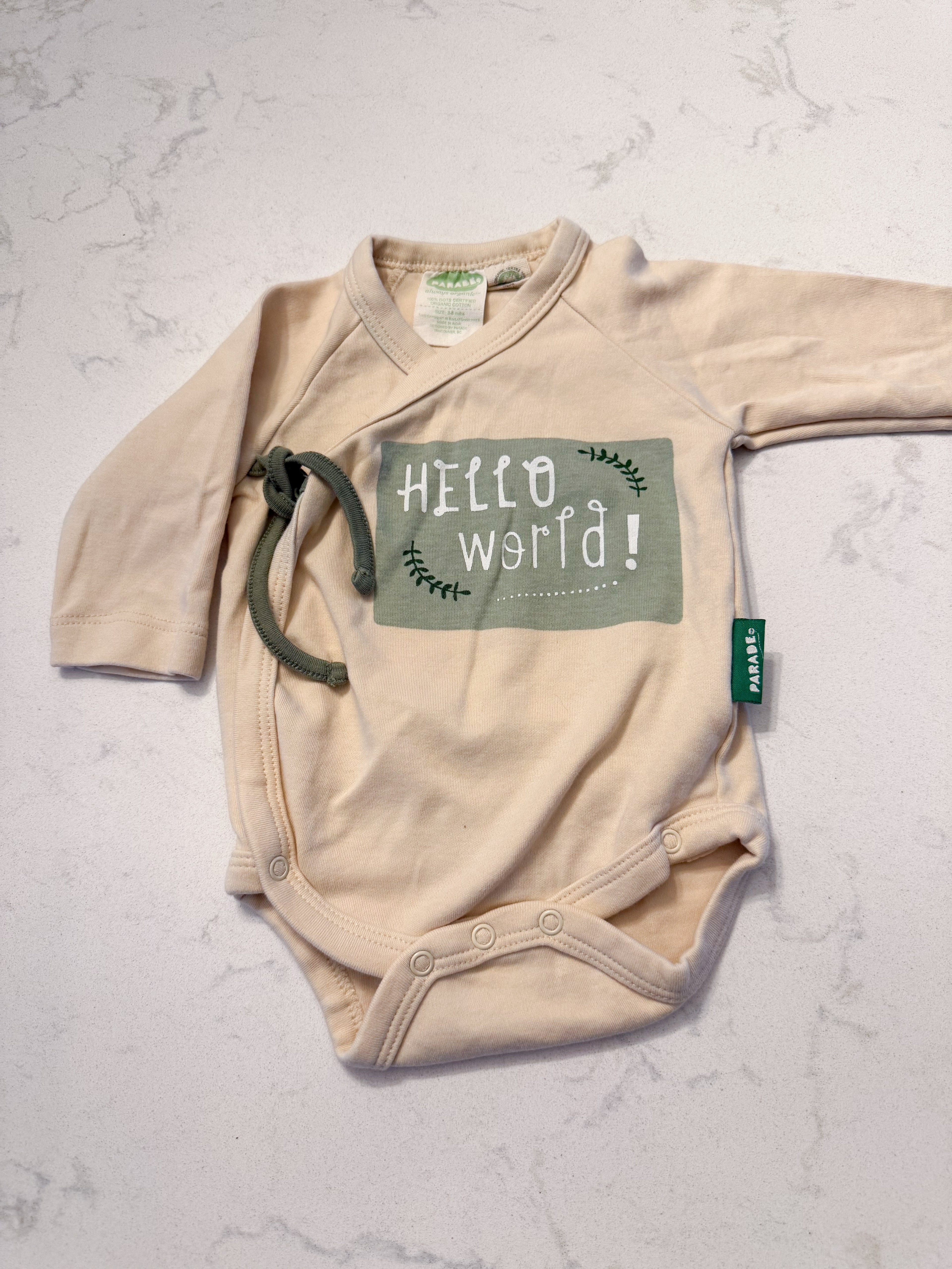 Parade Organics- 3-6m- VGUC- cream coloured wrap bodysuit with “hello world” on front