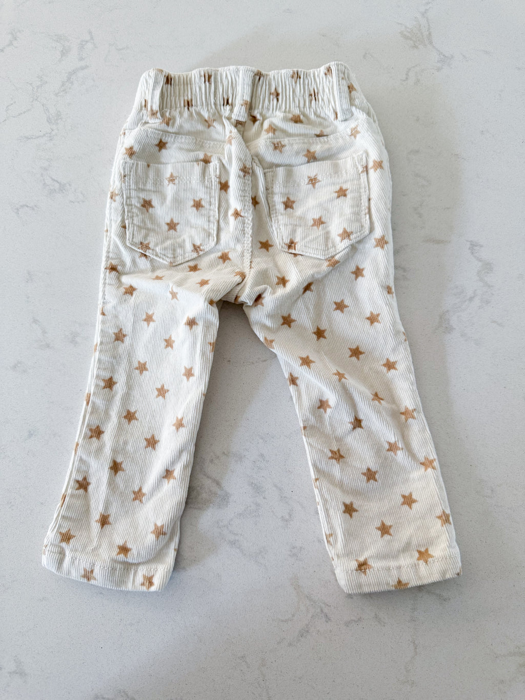 Old Navy- 12-18m- VGUC- cream coloured corduroy pants with brown stars