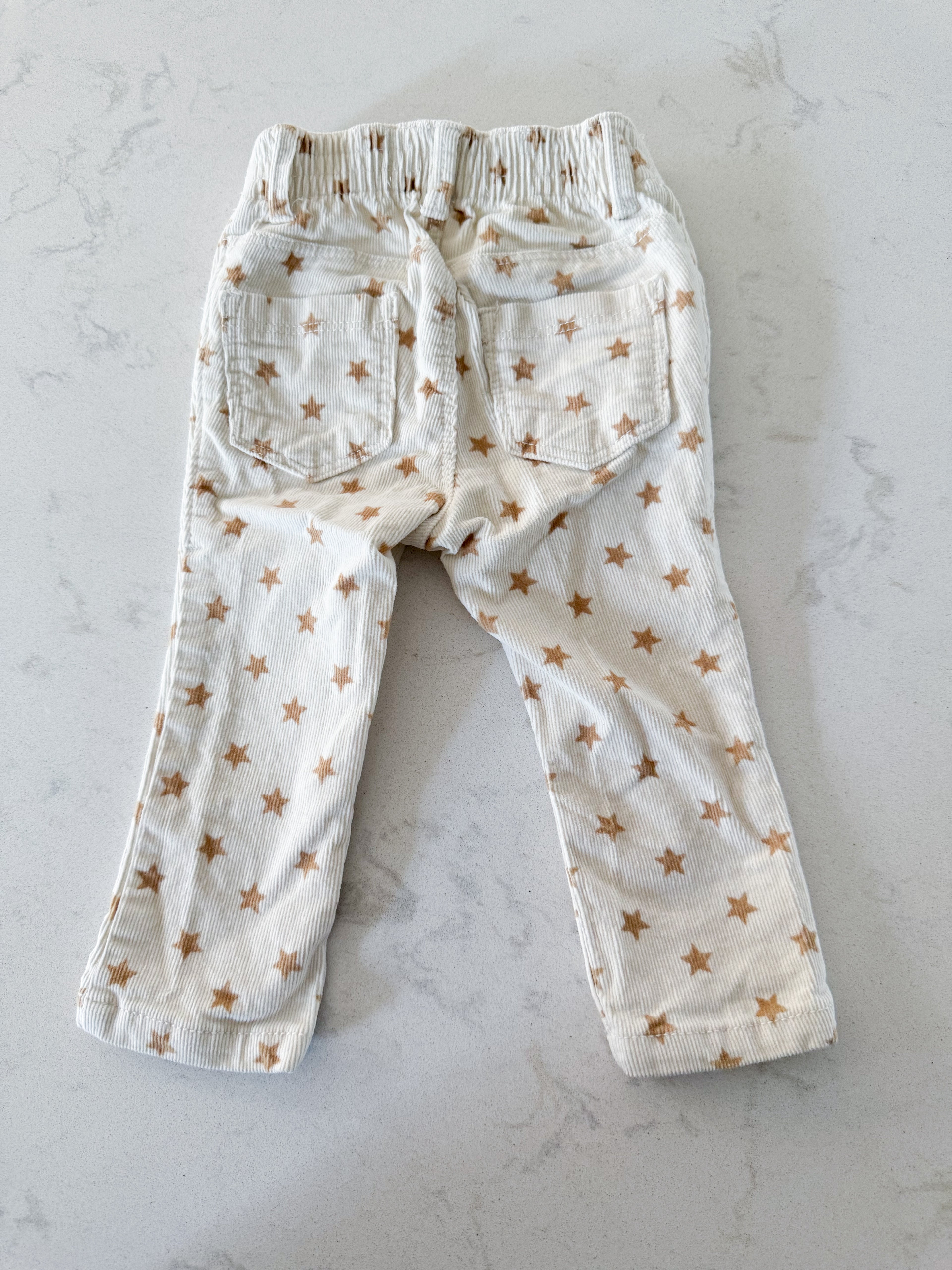Old Navy- 12-18m- VGUC- cream coloured corduroy pants with brown stars