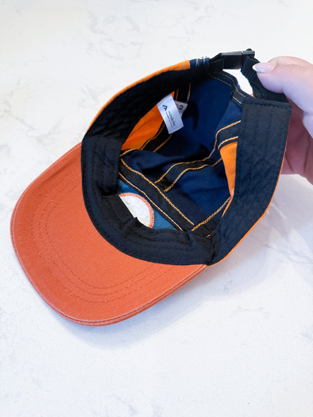 Black Mountain- 47cm (under 2 years)- VGUC- orange green and navy adjustable hat