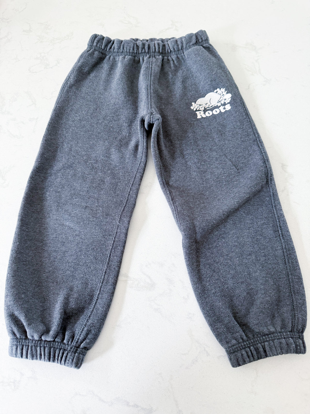 Roots- 4T- GUC- medium grey sweat pants with white logo