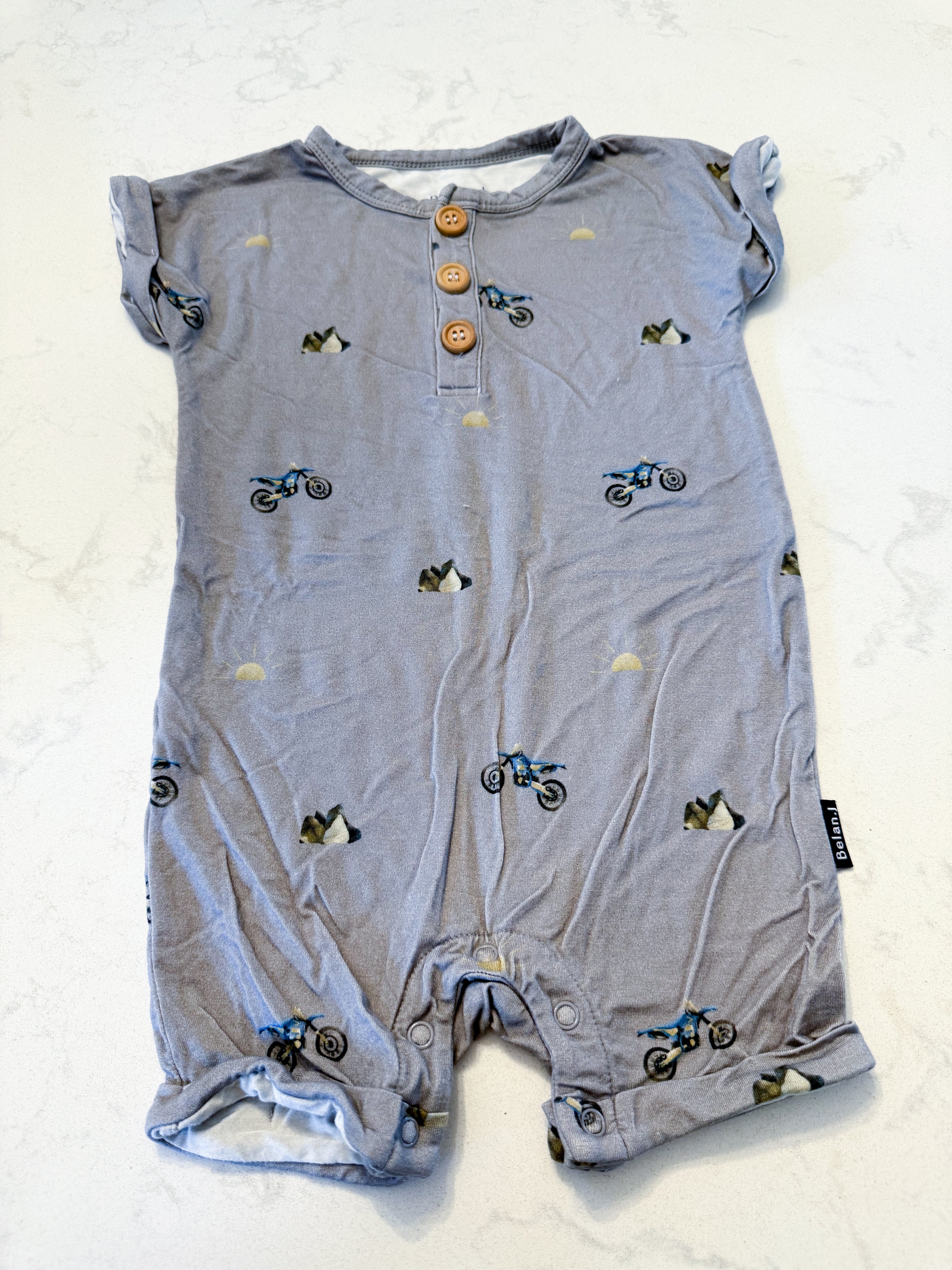 Belan J.- 18-24m- VGUC- grey short sleeve romper with minimalist dirt bike pattern