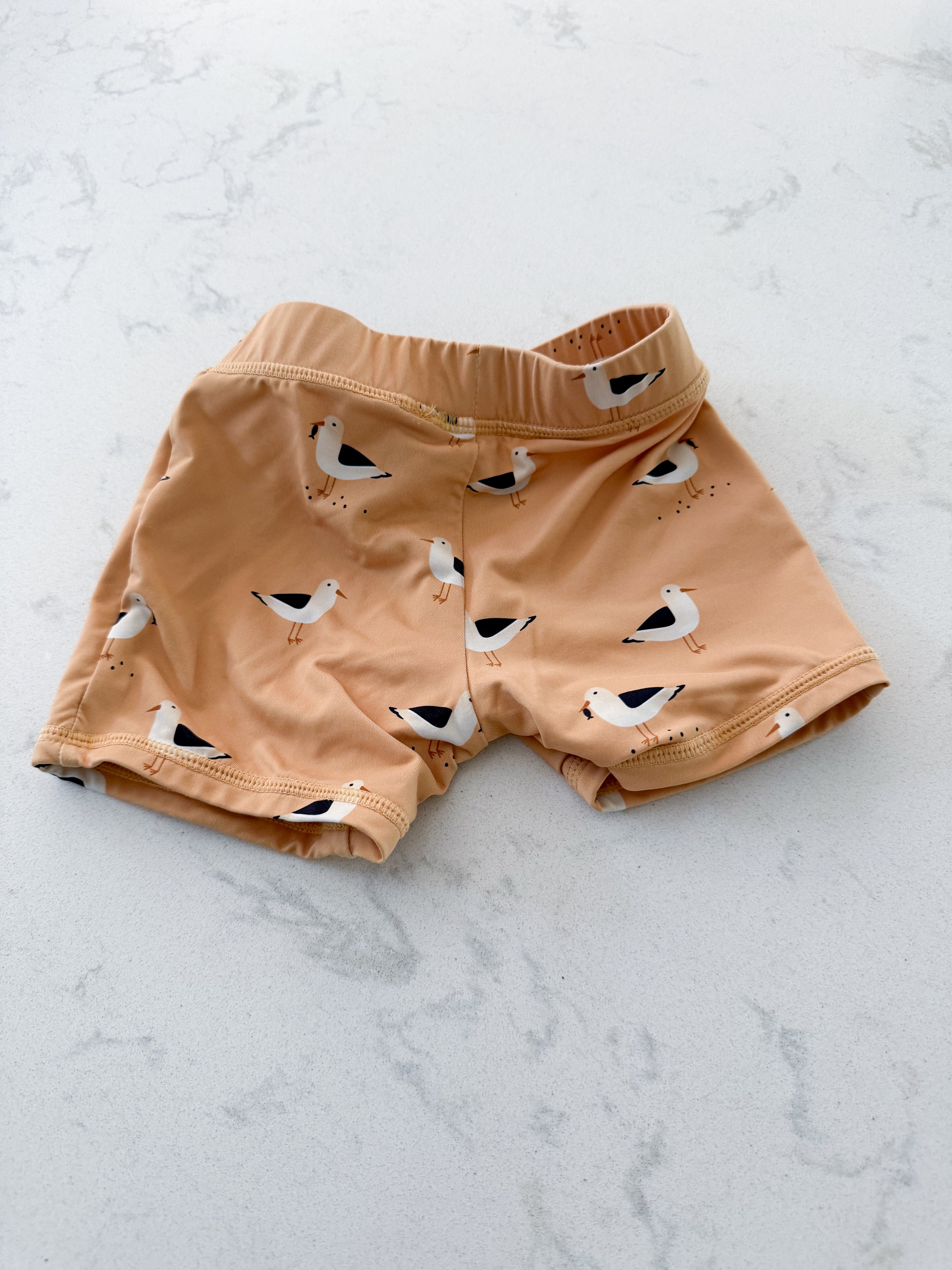 First by Petit Lem- 18-24m (fits tight)- VGUC- Sandy orange swim shorts with seagulls