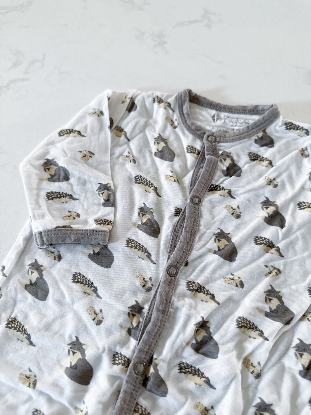 Kyte Baby- 0-3m- GUC- button up bamboo footless pajamas. White with woodland creatures