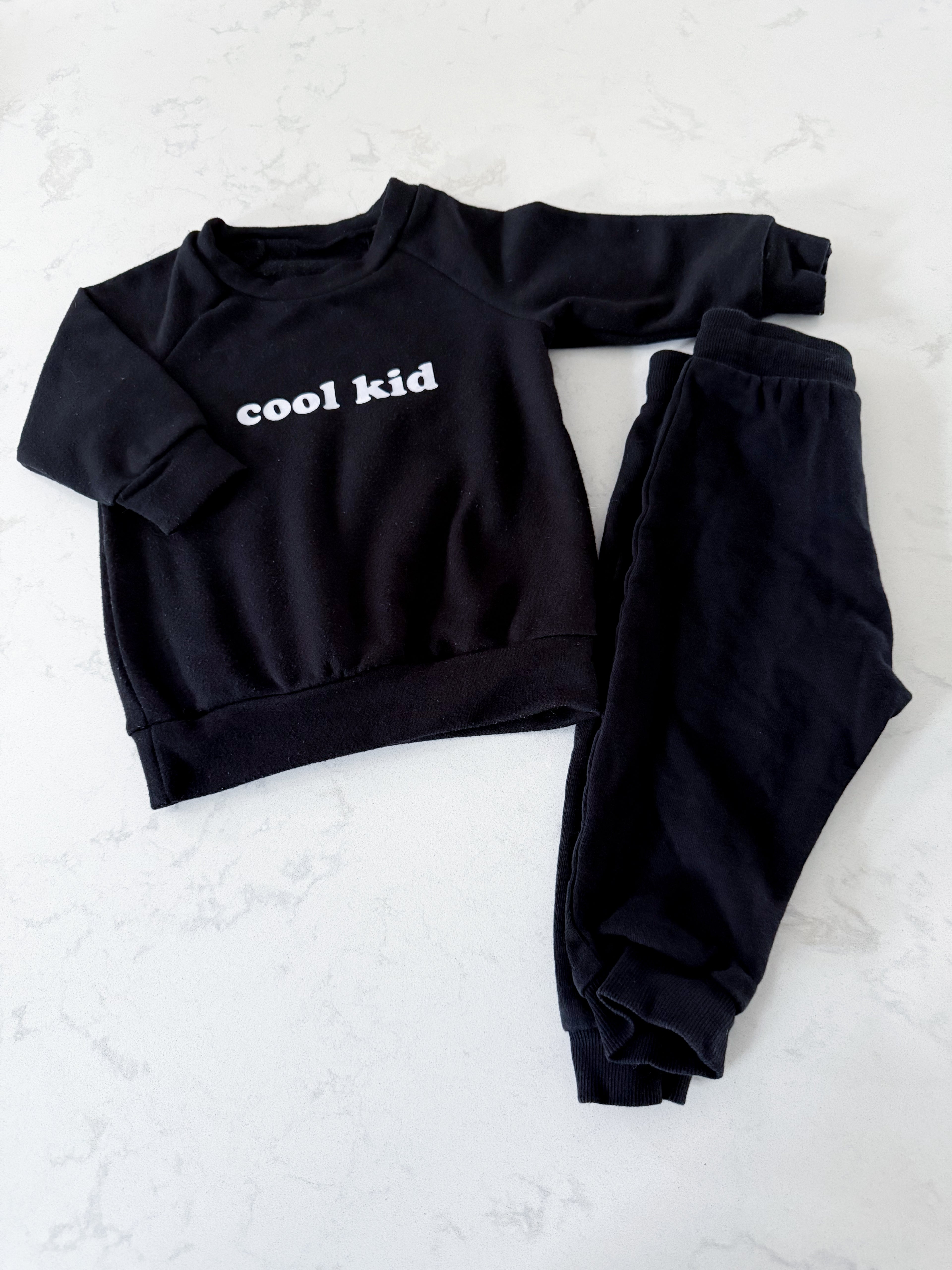 Thyme and H&M (curated)- 6-12m- GUC- black sweat set with “cool kid”