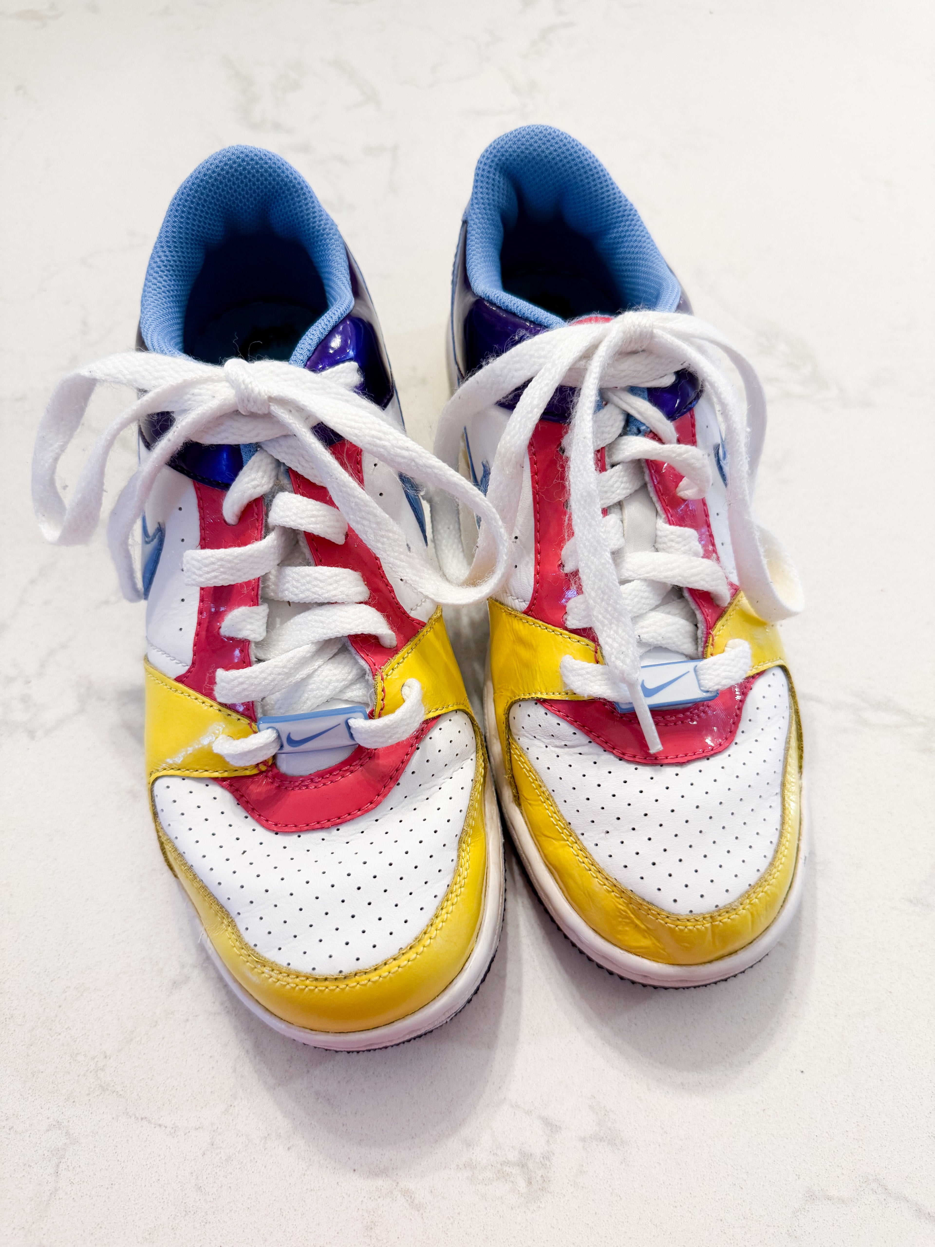 Nike- 4Y- GUC- White pink purple yellow and blue shoes with laces