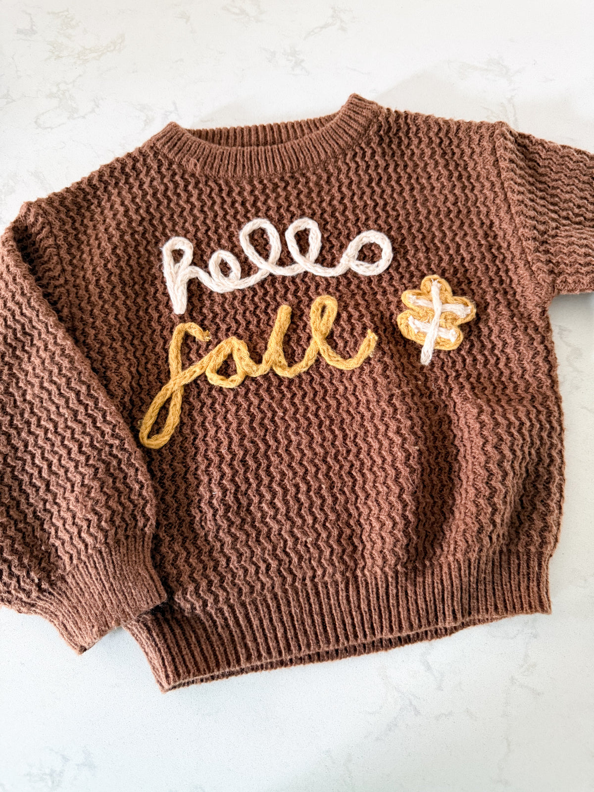 No brand (homemade)- 4-5T- GUC- brown knit crewneck with knit lettering “hello fall”