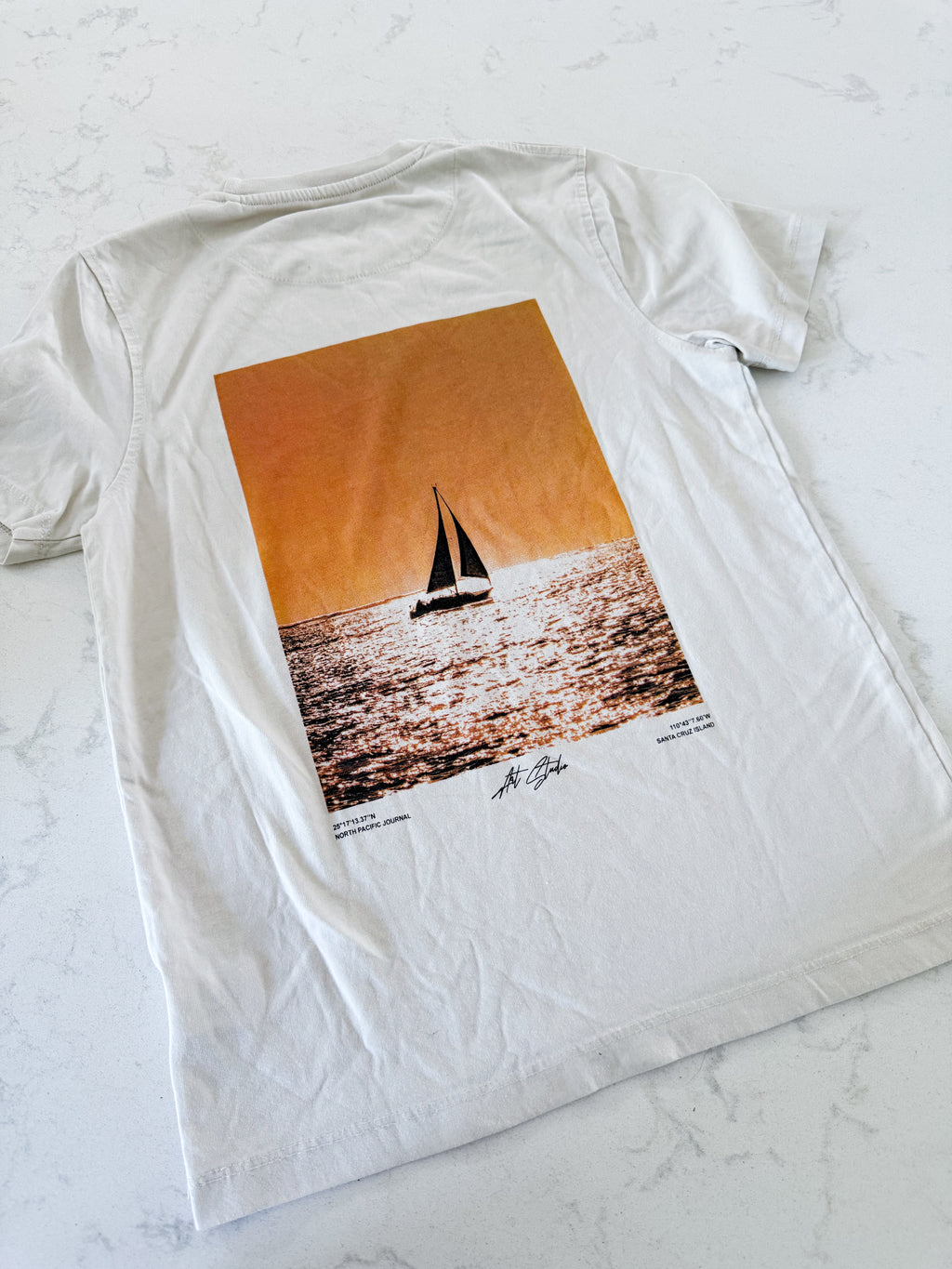 Denim and Flower- 9-10Y- GUC- beige t shirt with sailboat graphic on back