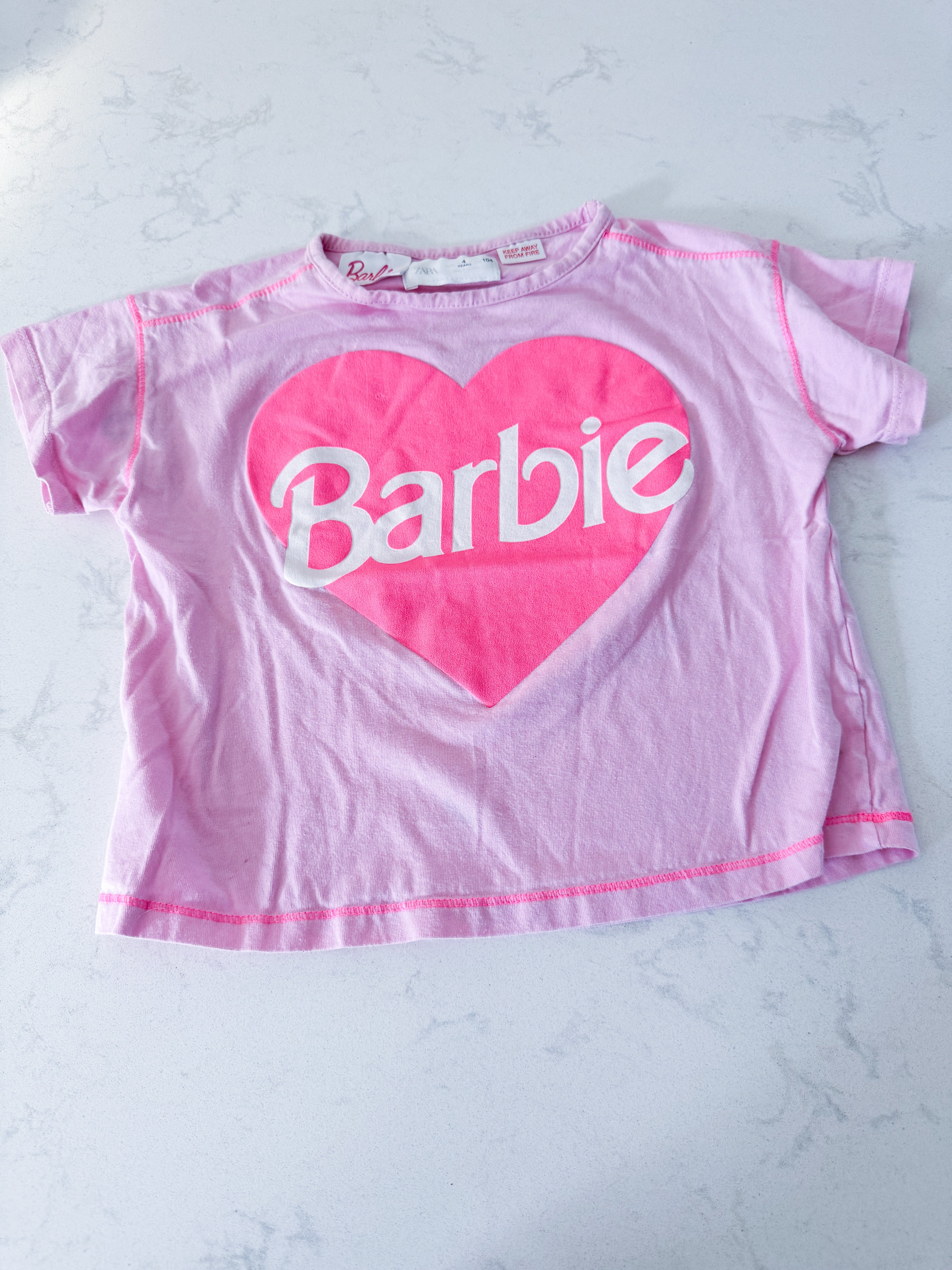 Zara- 4T- VGUC- pink short t shirt with Barbie logo in heart
