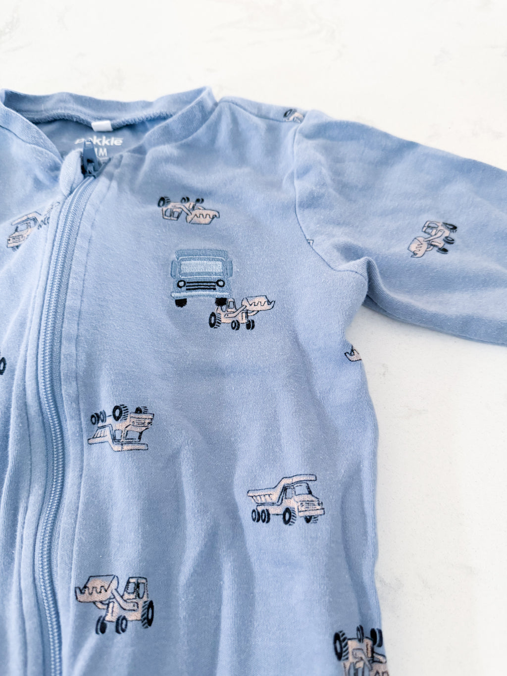 Pekkle- 24m- GUC- light blue zip up footie Jammies with embroidered construction trucks