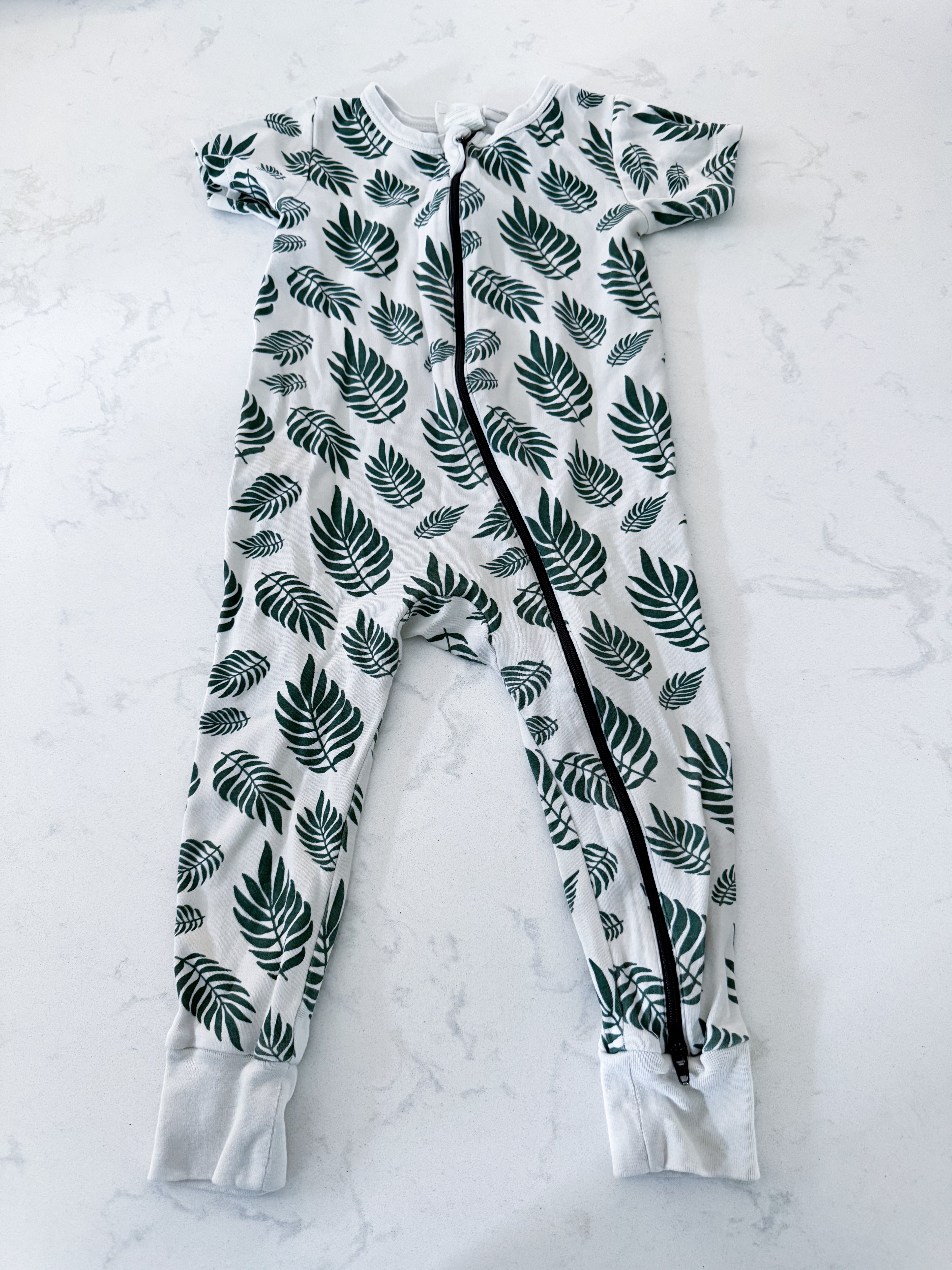 Parade Organics- 18-24m- VGUC- off white palm leaf’s patterned two way zip up romper