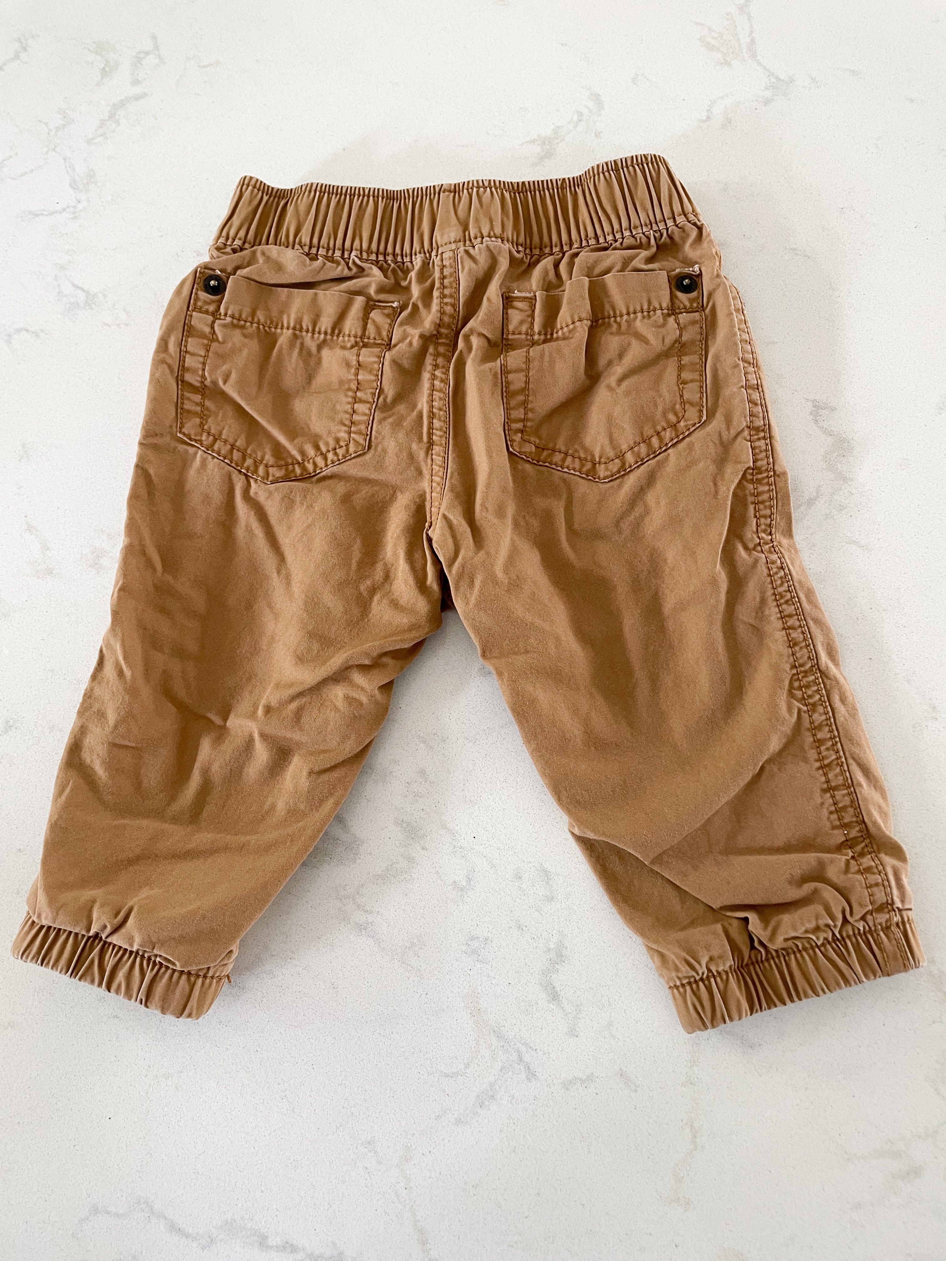 Gap- 6-12 months- tan pants with black and red checkered cotton lining