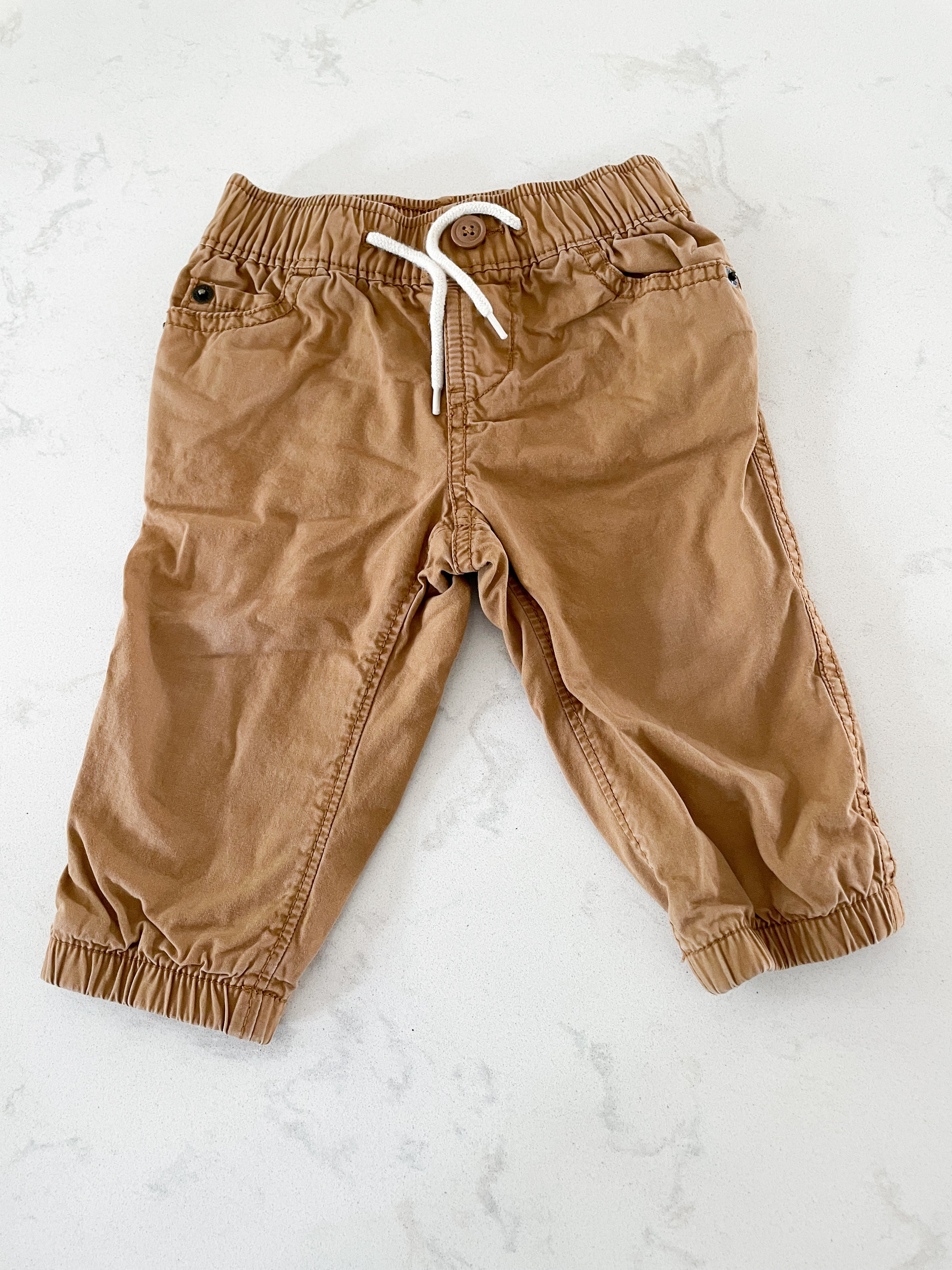 Gap- 6-12 months- tan pants with black and red checkered cotton lining