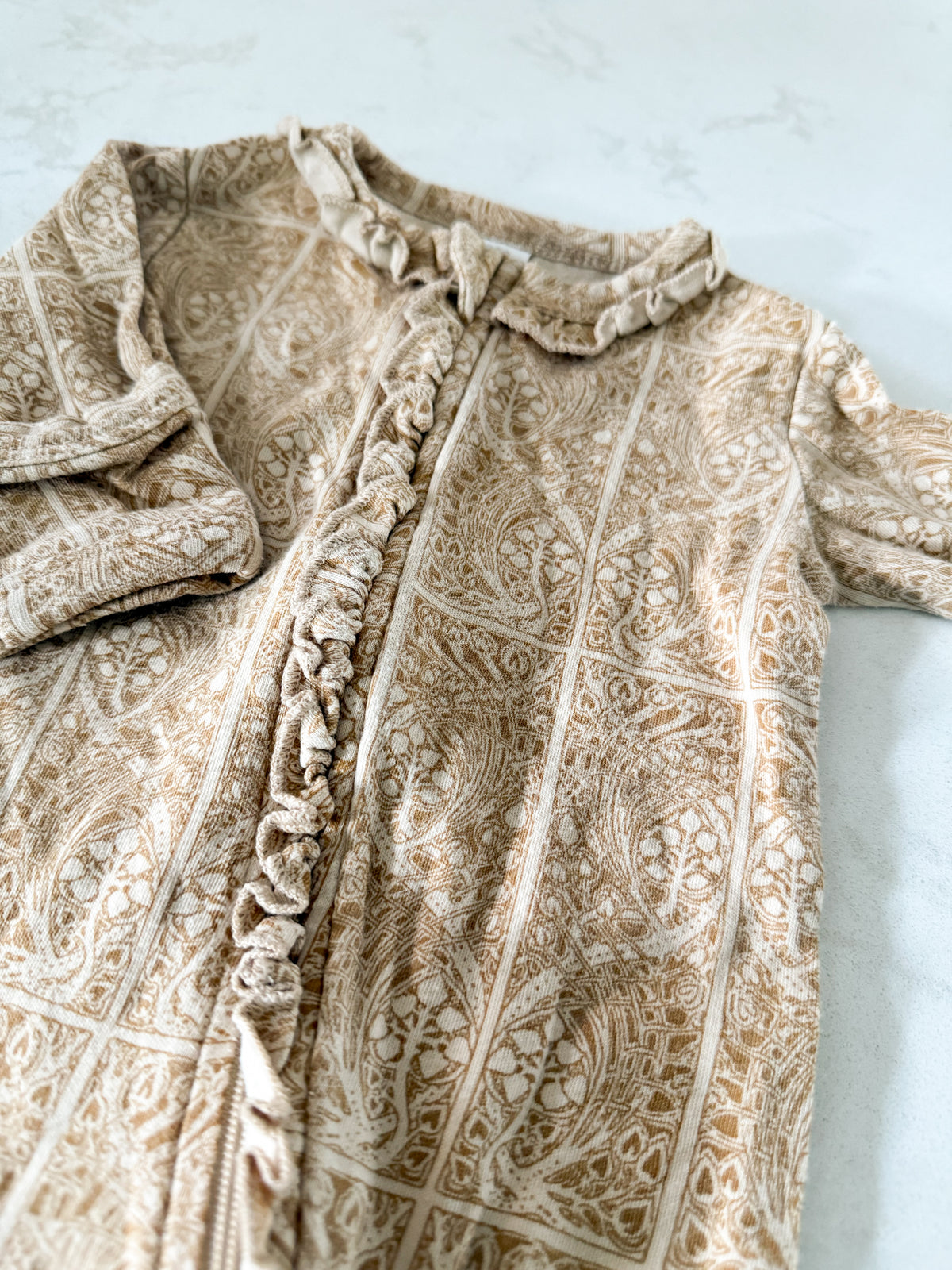 Kate Quinn- 0-3m- GUC- yellowish brown ruffle zip up footie Jammies