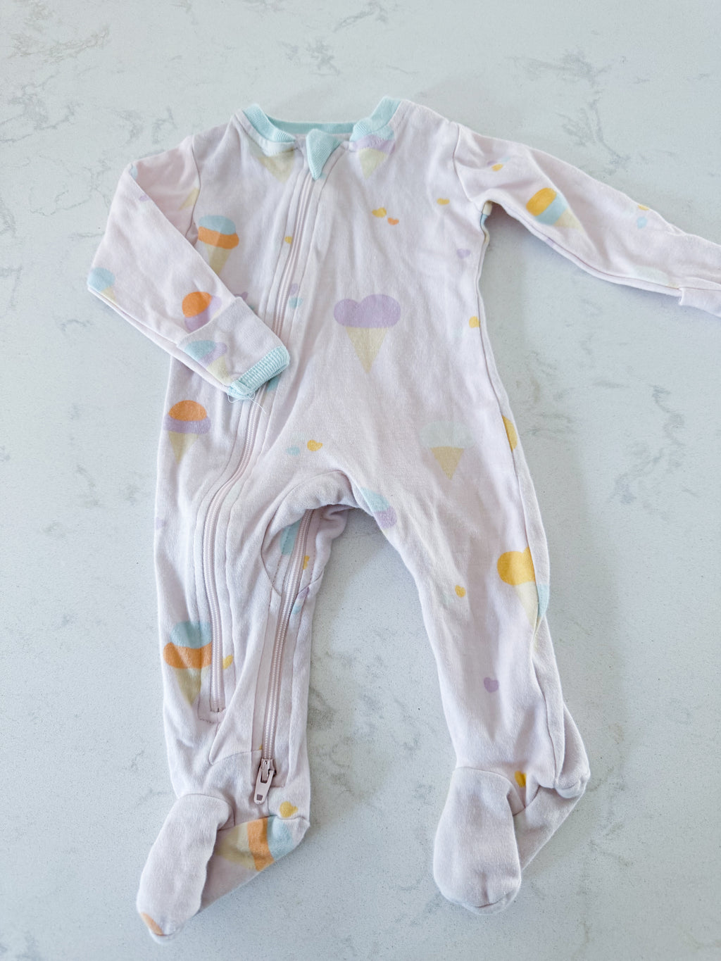 Zippy Jamz- 0-3m- GUC- light pink zippy footie with pastel ice cream print