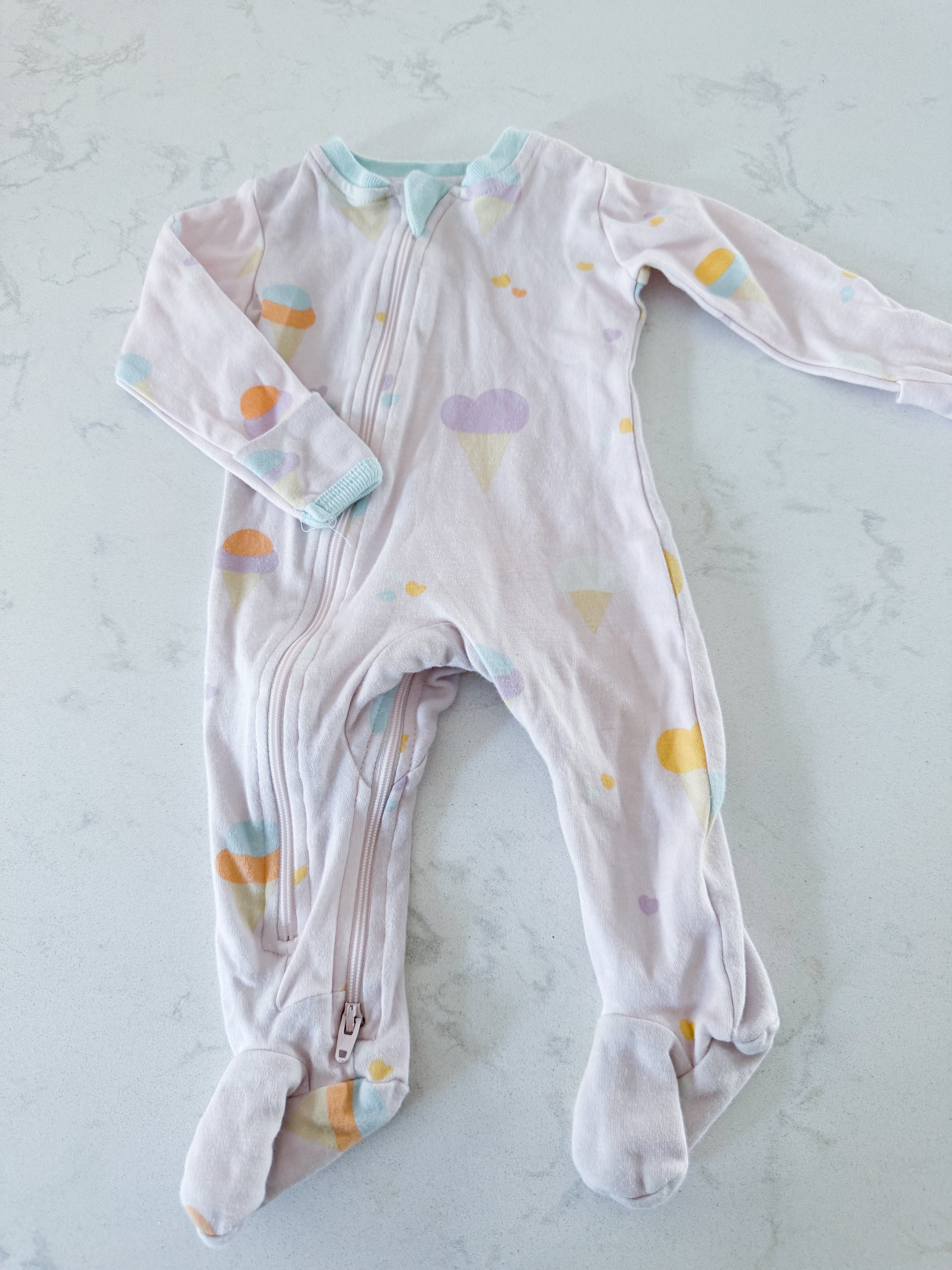 Zippy Jamz- 0-3m- GUC- light pink zippy footie with pastel ice cream print