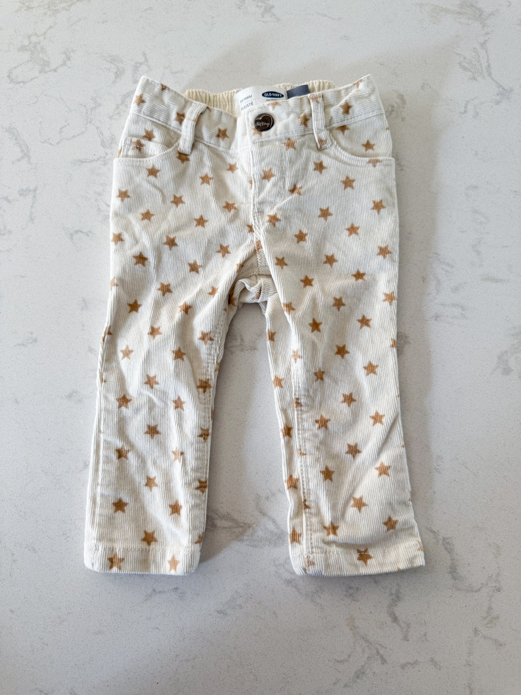 Old Navy- 12-18m- VGUC- cream coloured corduroy pants with brown stars