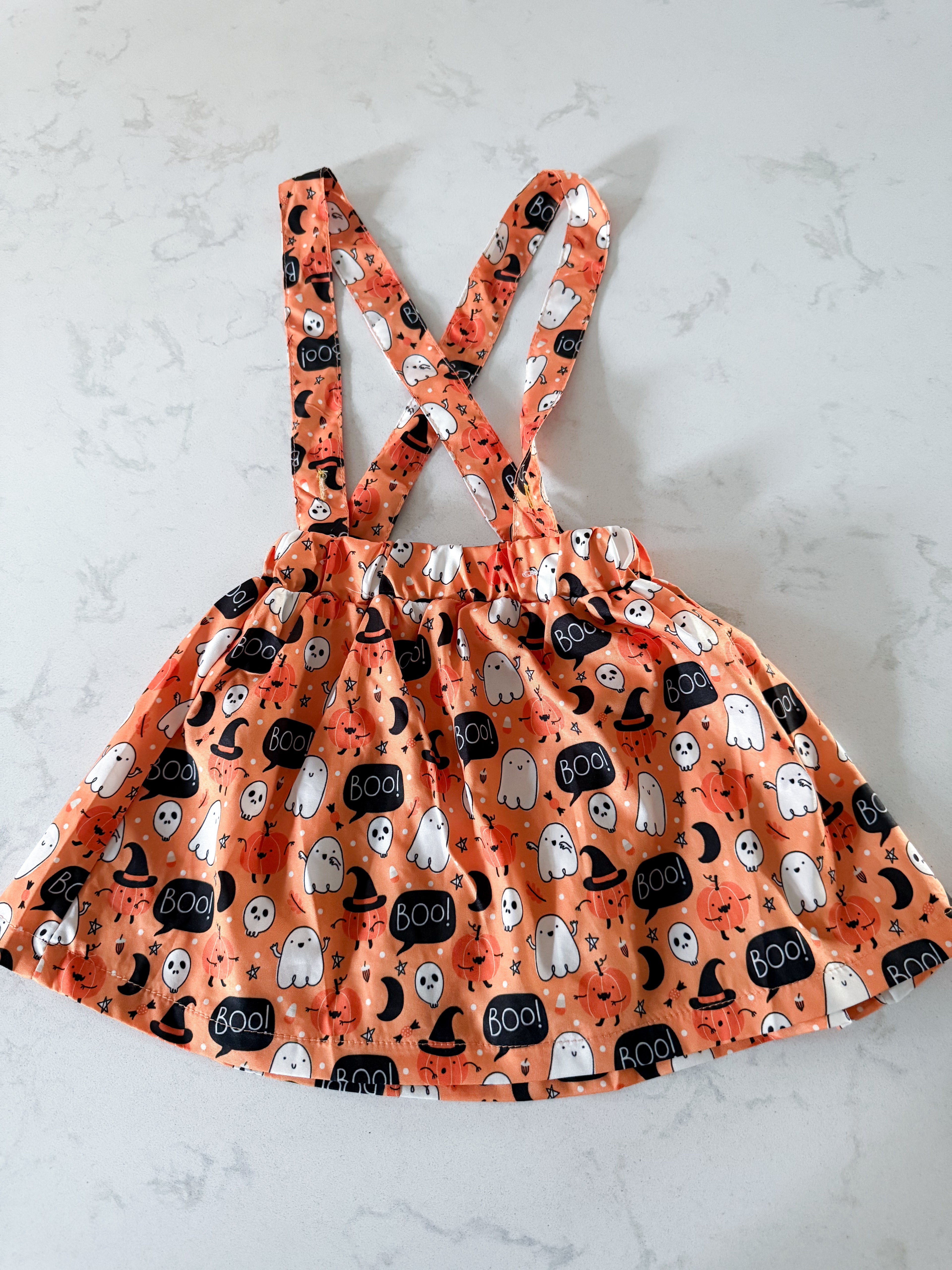 No brand- 12-18m- VGUC- orange silk like skirtall with Halloween print