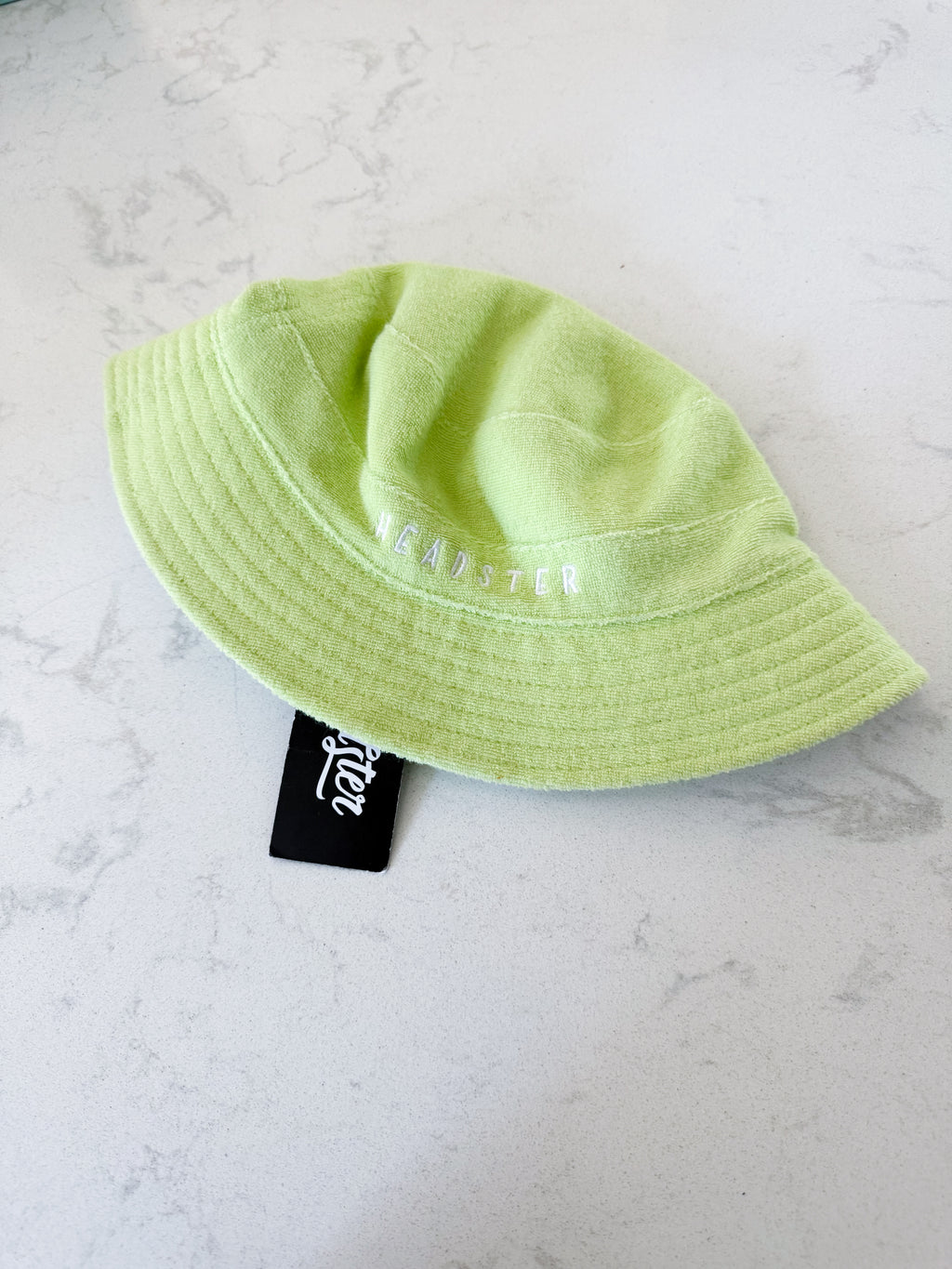 Headster- 52cm- BNWT- green checkered and Terry towel reversible hat