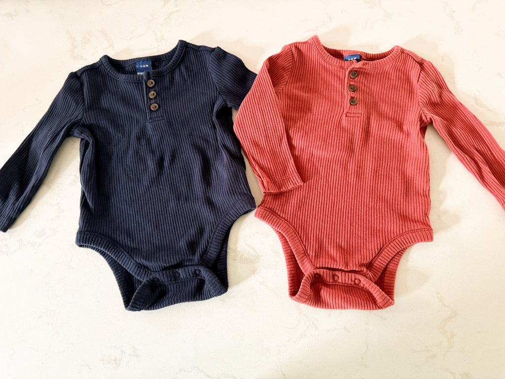 Old Navy- 3-6m- VGUC- two long sleeve ribbed bodysuits, navy and terracotta colouring