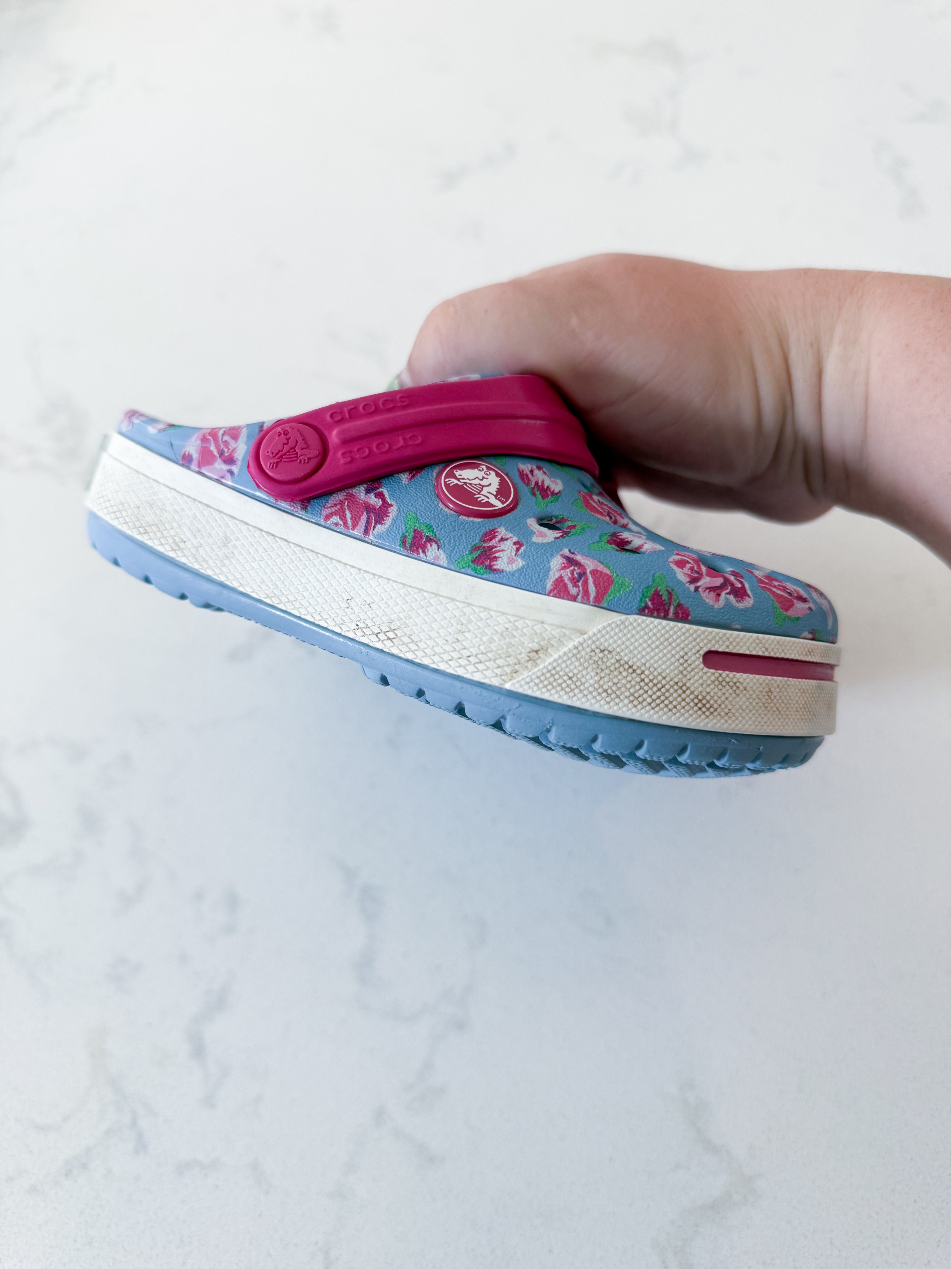 Crocs- 8/9C- GUC- light blue slip on crocs with pink florals