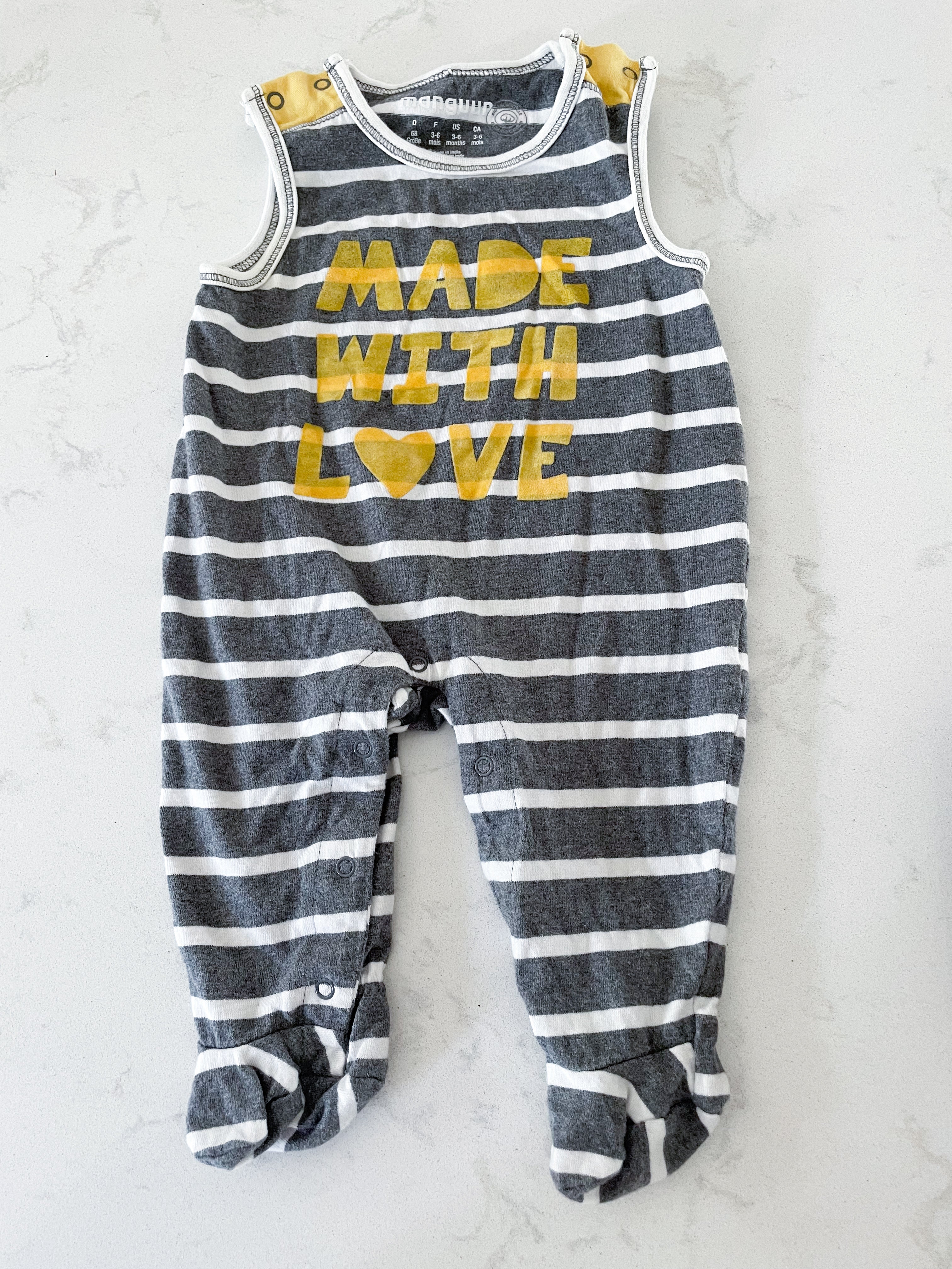 Manguun- 3-6 months- footie romper grey and white striped with yellow writing