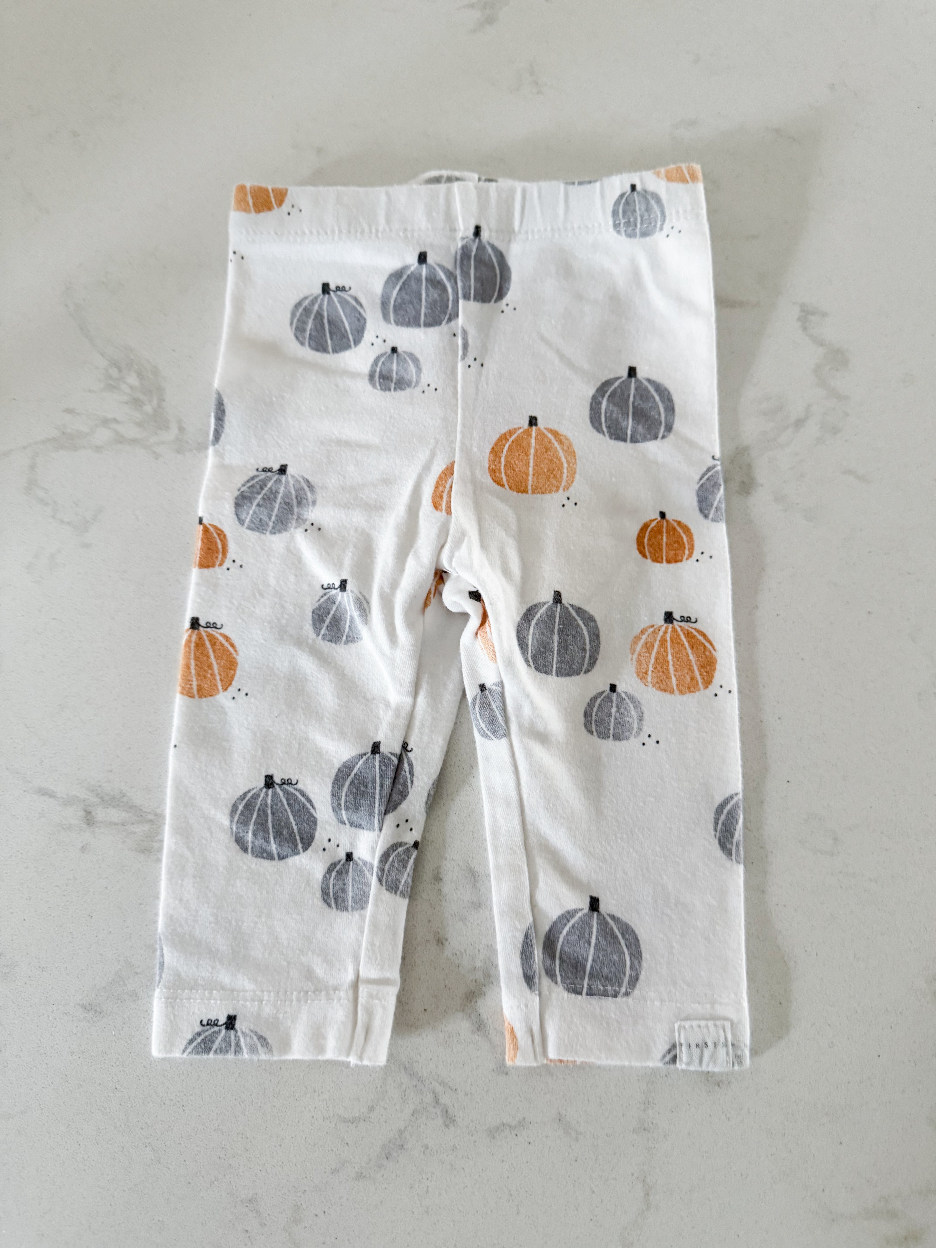 Firsts by Petit Lem- 3m- GUC- White leggings with grey and orange pumpkins