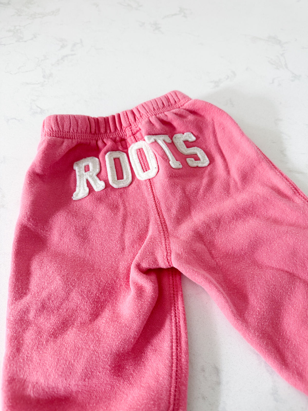 Roots- 6-12m- PLAY- bubblegum pink sweat pants with symbol