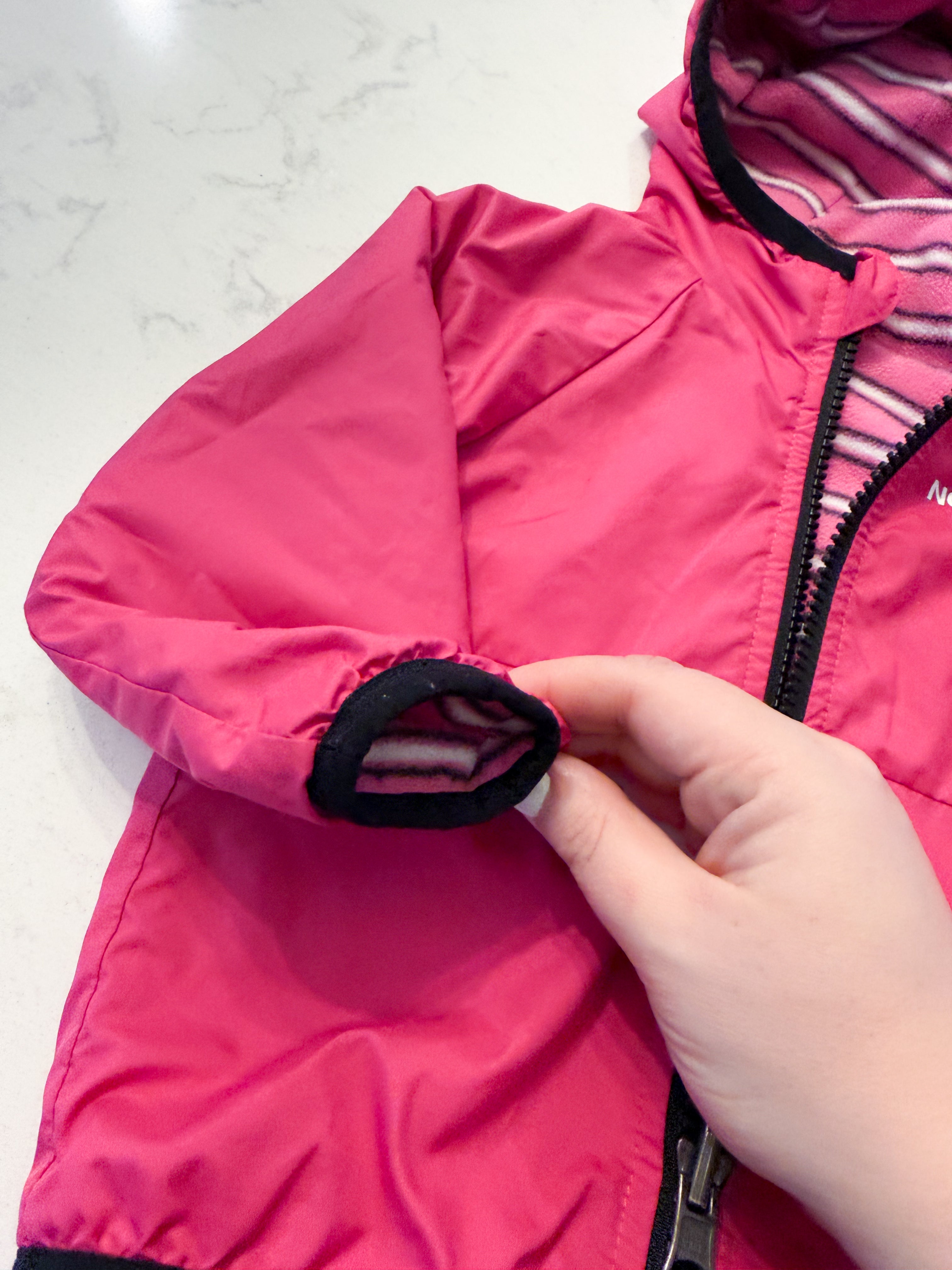 The North Face- 6-12m- VGUC- wind wall reversible bright pink jacket with fleece interior.