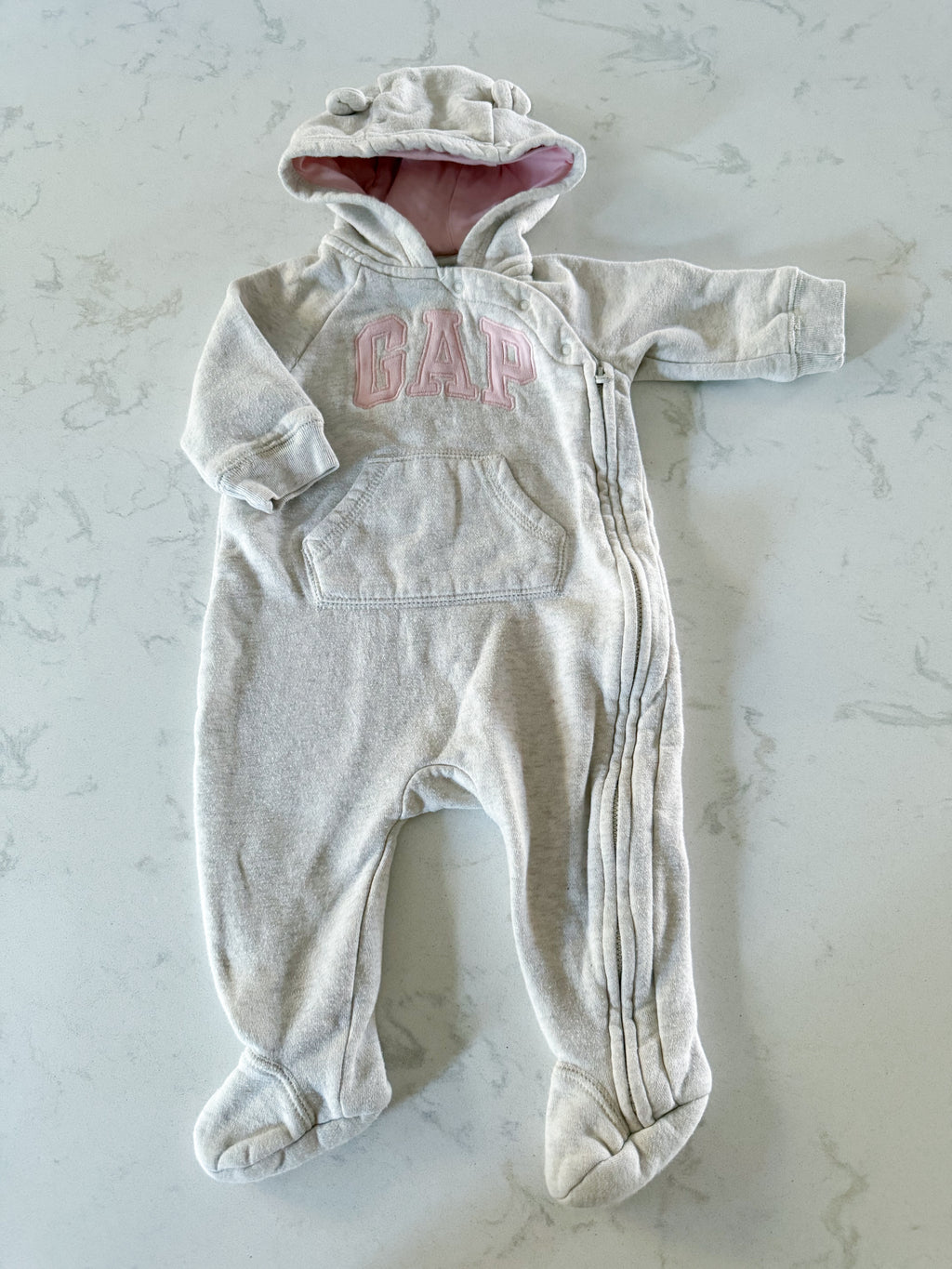 Gap- 3-6m- GUC- cream coloured one piece romper/ sweat suit with pink writing