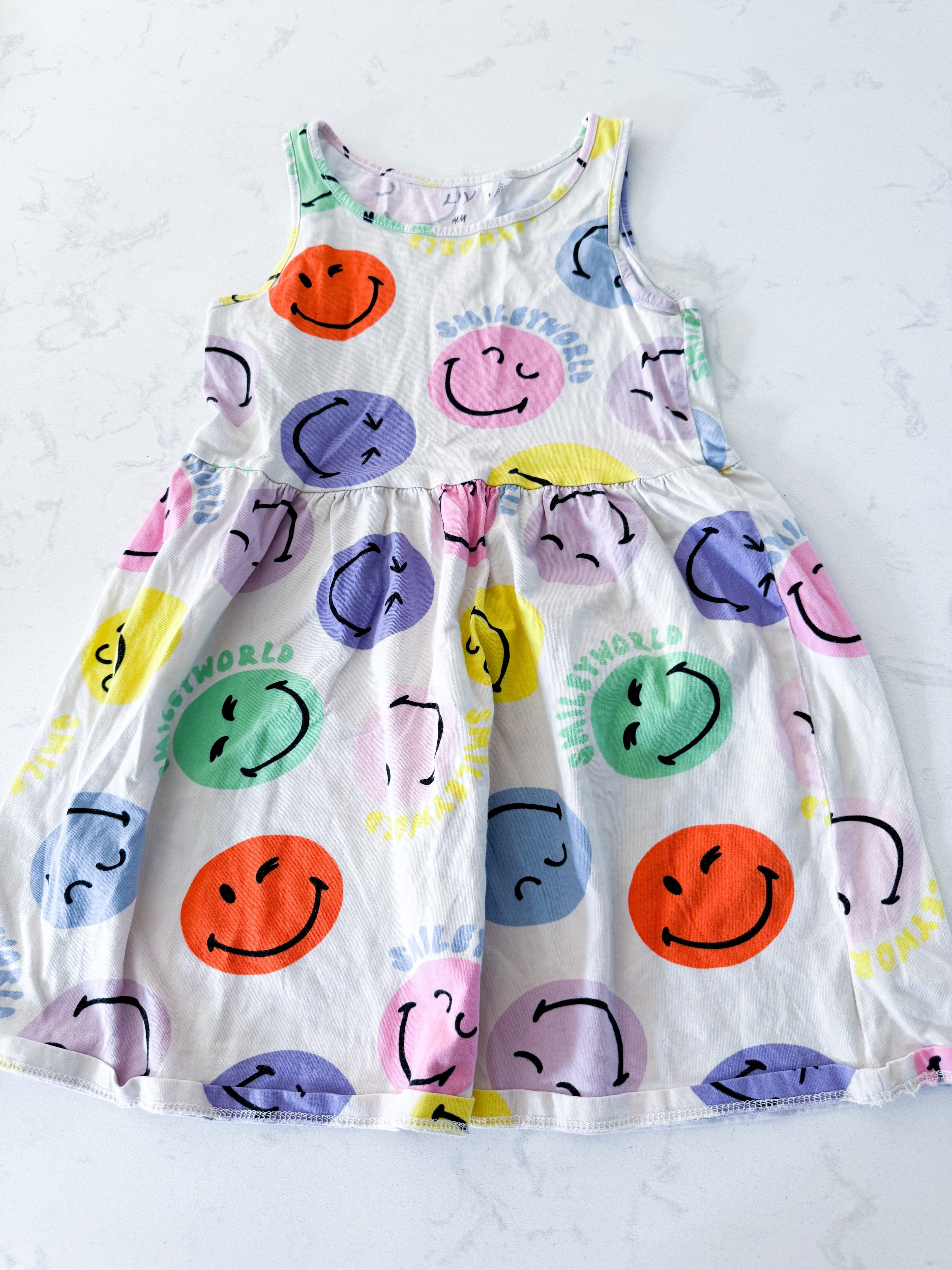 H&M- 5T- VGUC- cream coloured dress with bright multicoloured smileys