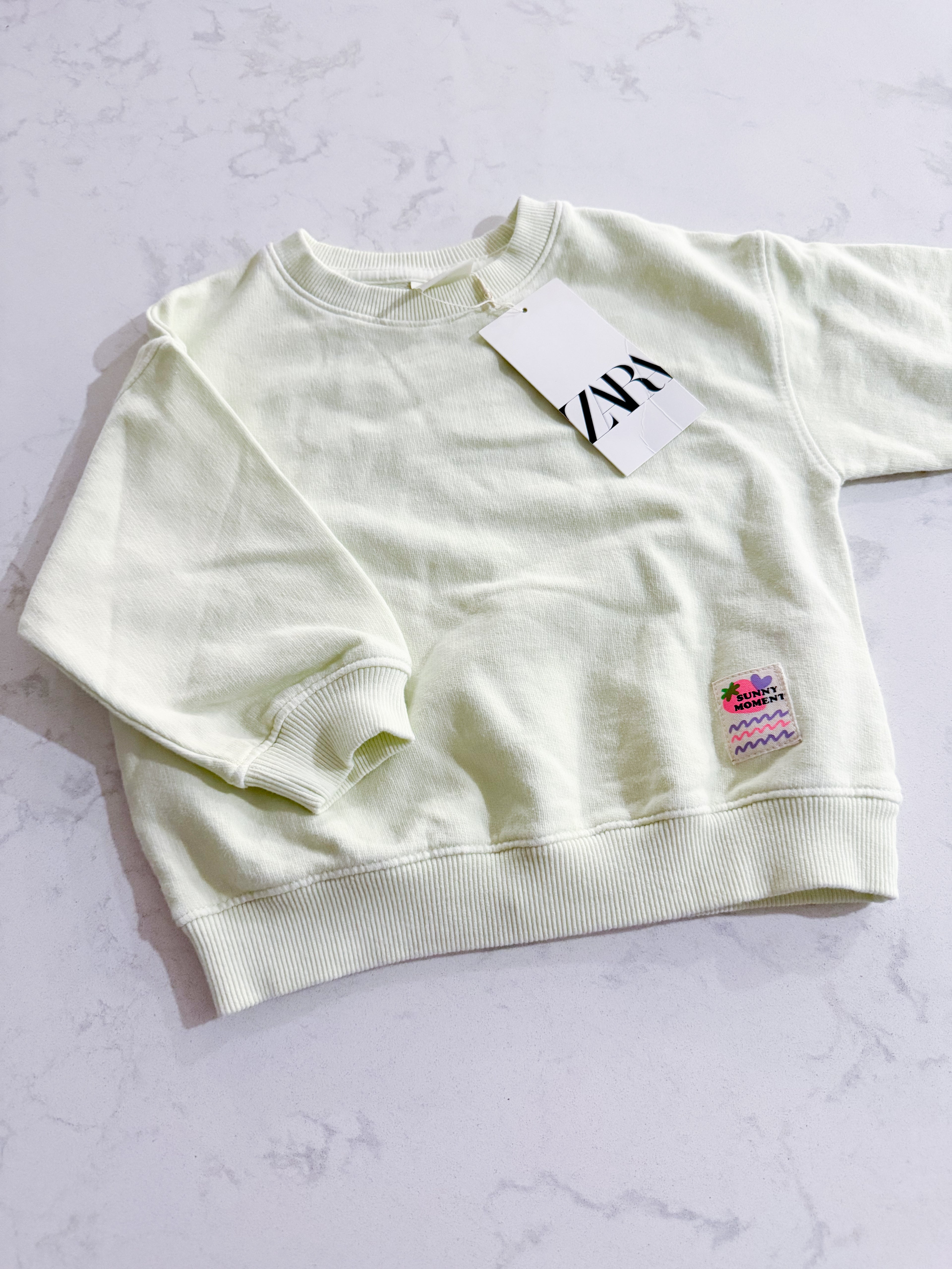 Zara- fits 2T- BNWT- bright light green crewneck with sunny moments patch