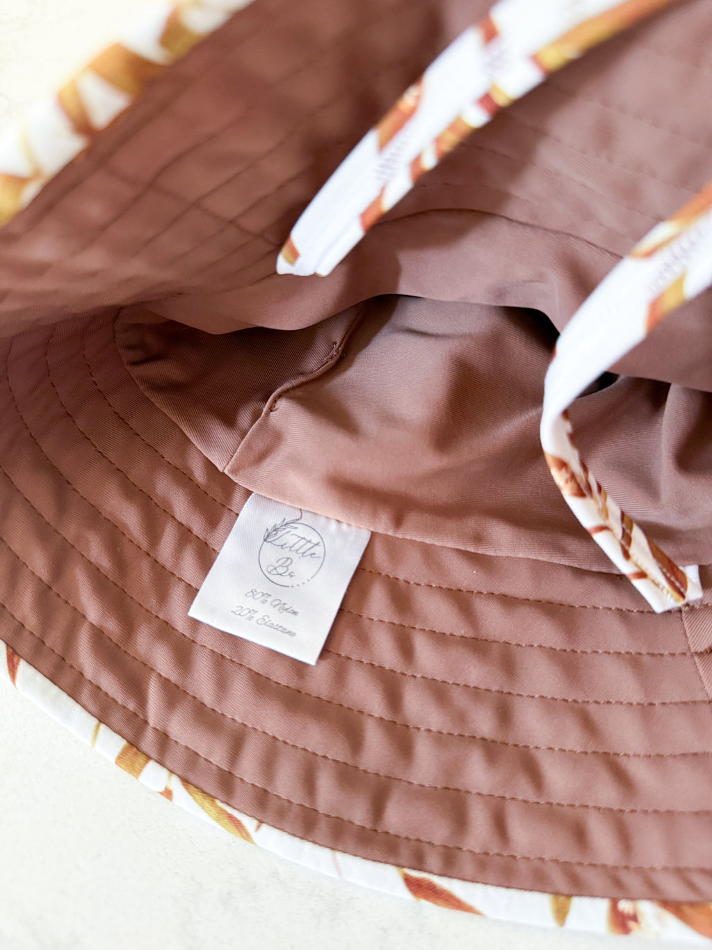 Little Bo- infant size- VGUC- white with brown leaves swim hat