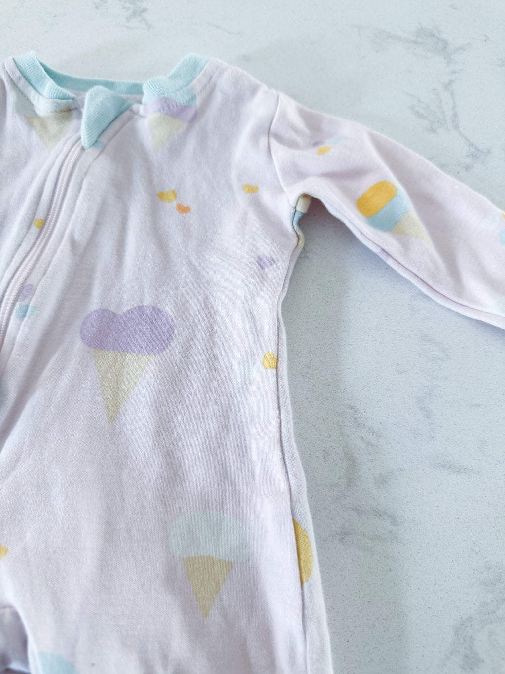 Zippy Jamz- 0-3m- GUC- light pink zippy footie with pastel ice cream print