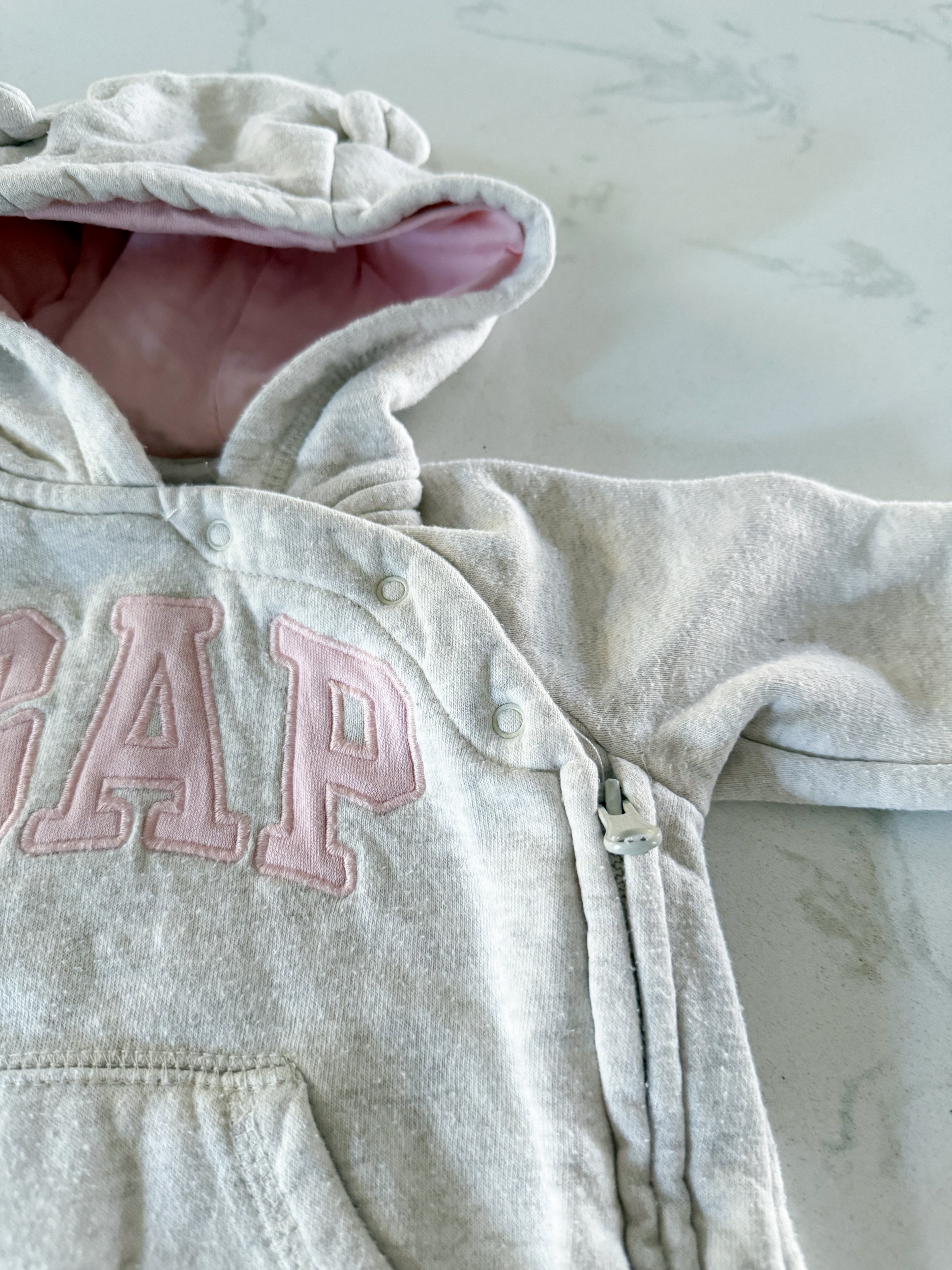 Gap- 3-6m- GUC- cream coloured one piece romper/ sweat suit with pink writing