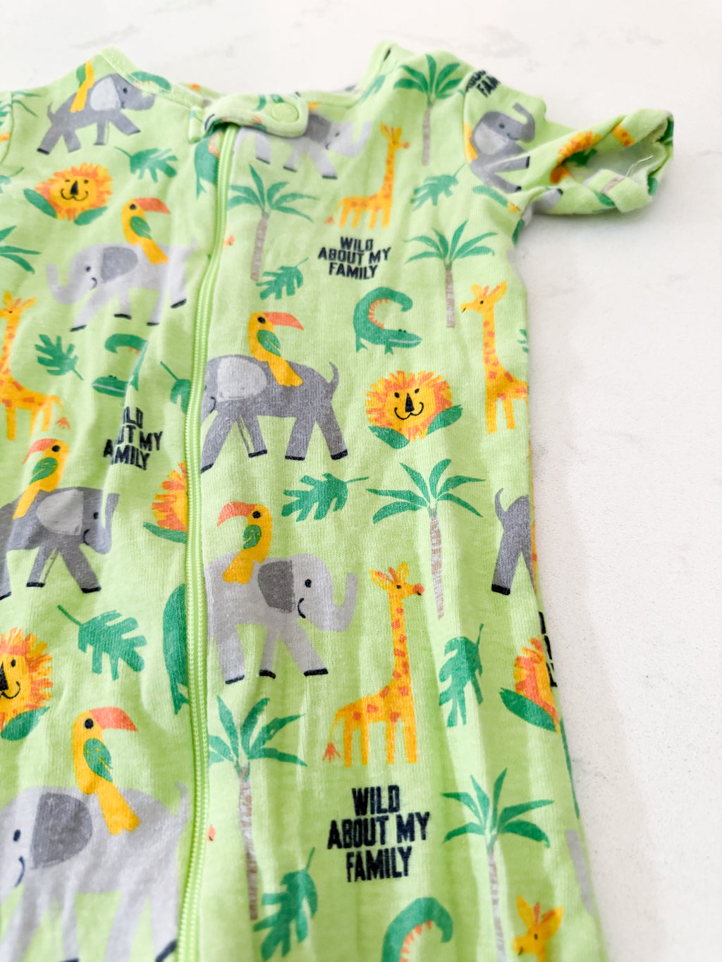 The Children’s Place- 2T- GUC- bright green short sleeve zip up jammies with animals