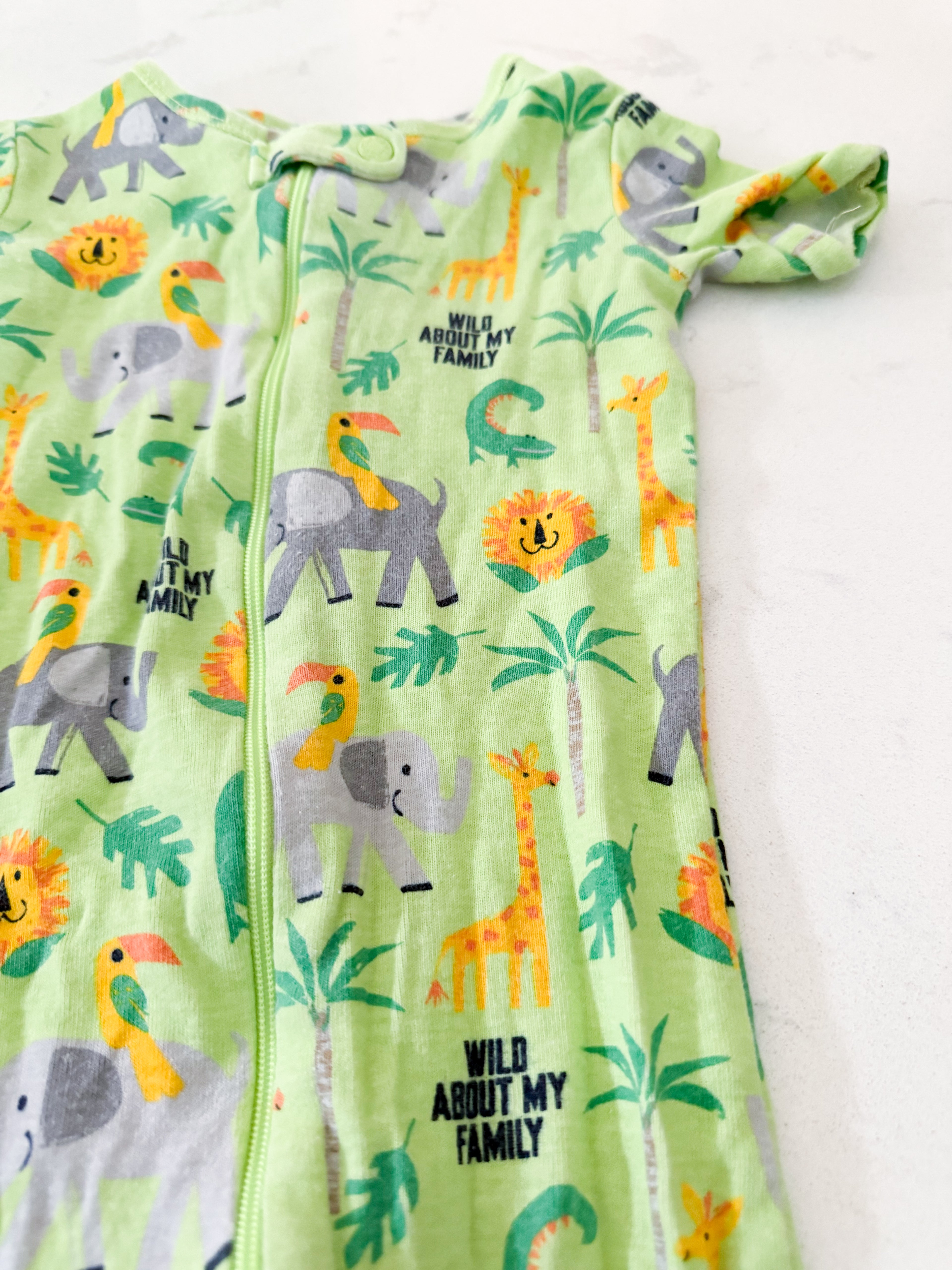 The Children’s Place- 2T- GUC- bright green short sleeve zip up jammies with animals
