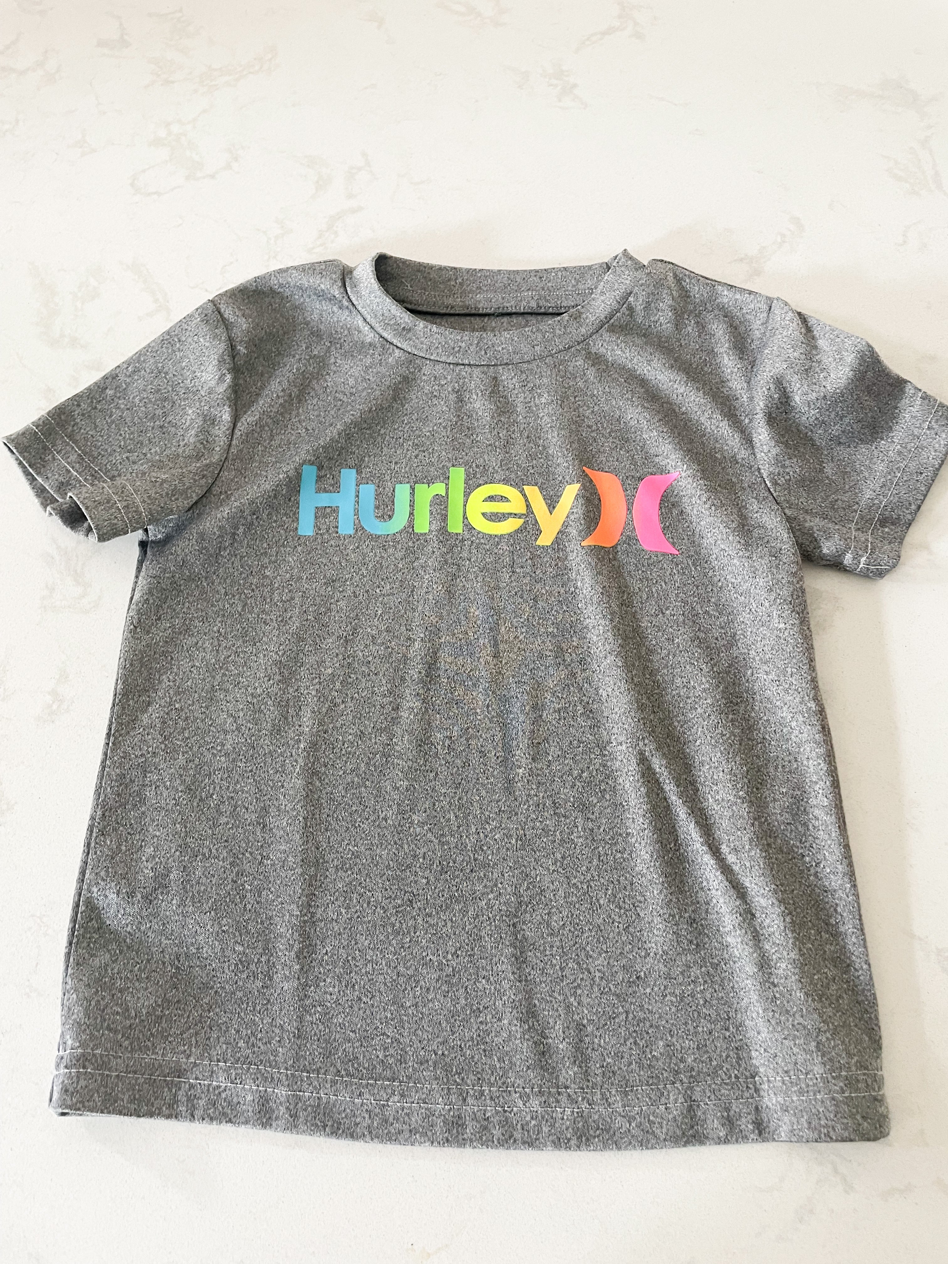 Hurley-3T- VGUC - grey t shirt with neon rainbow writing