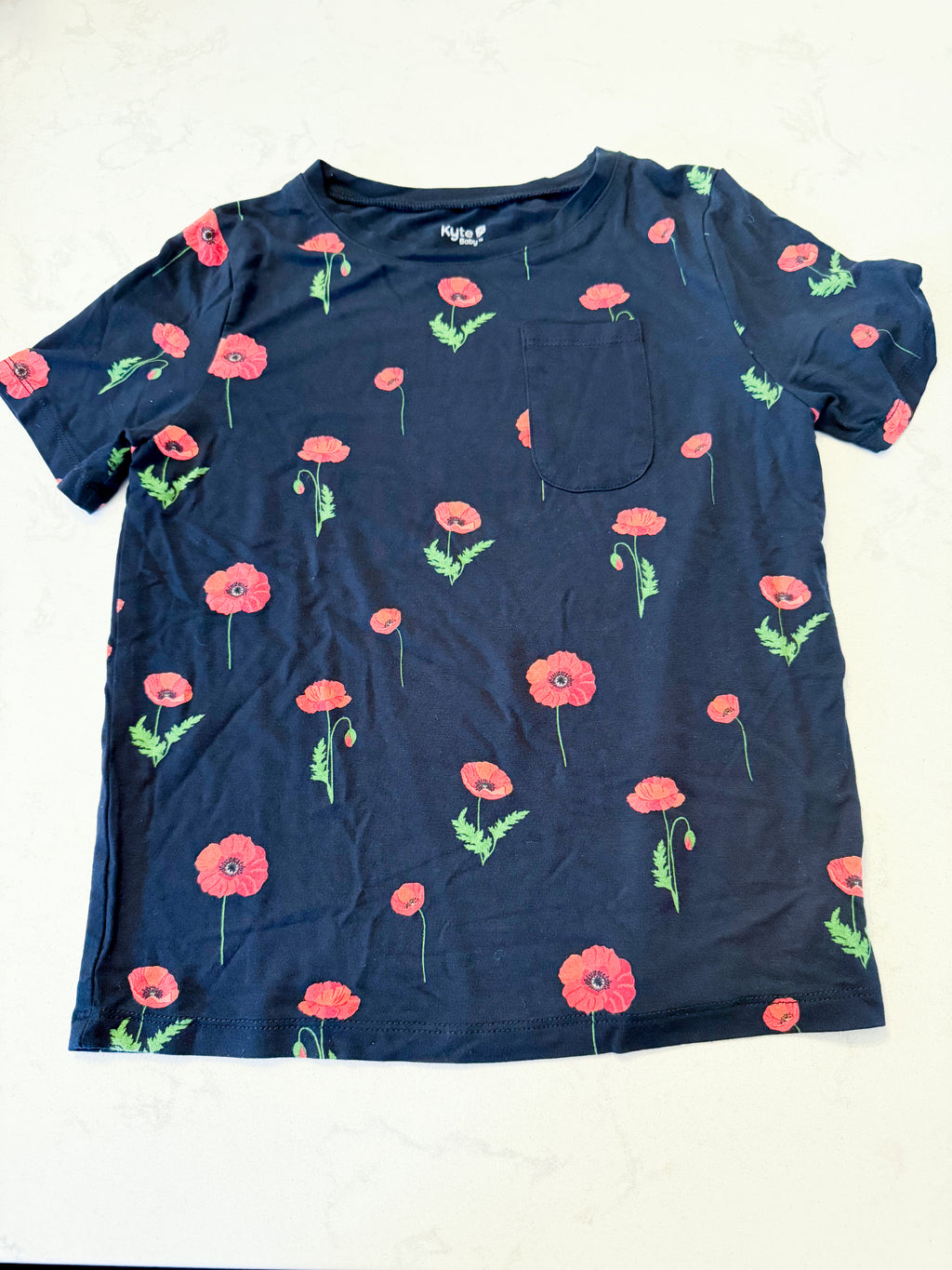 Kyte Baby- 7Y- VGUC- black pocket tee with poppy pattern