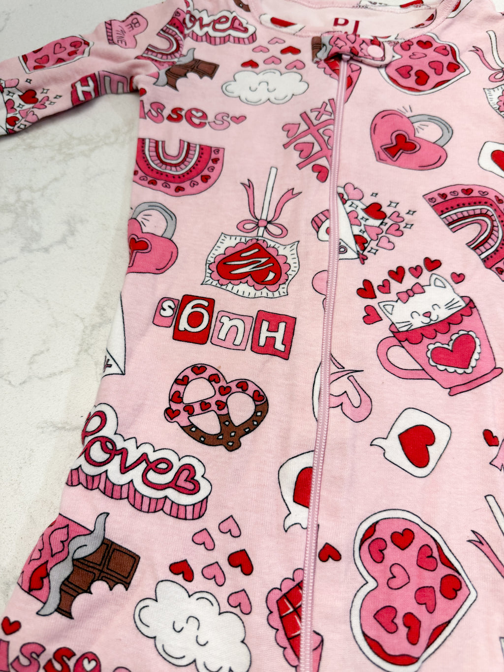 The Children’s Place- 2T- GUC- pink valentines footie pajamas with chocolates
