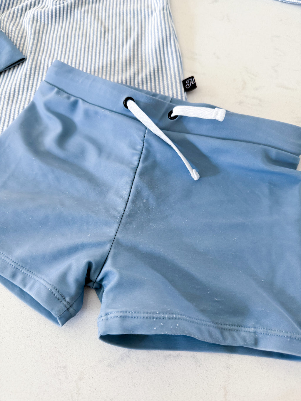 Honeysuckle Swim Company- 4/5Y- PLAY- dusty blue and white striped rashguard with matching blue shorts