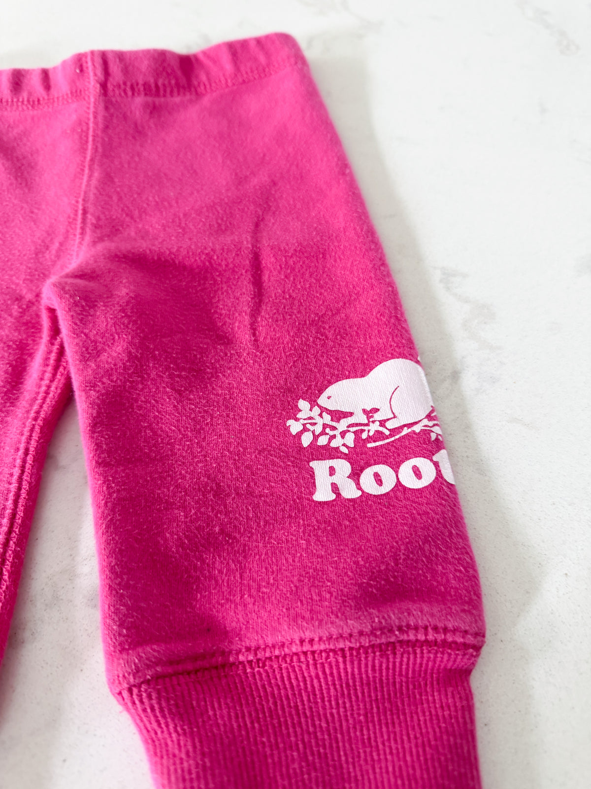 Roots- 3-6m- PLAY- bright pink leggings with cuffs and white Roots logos