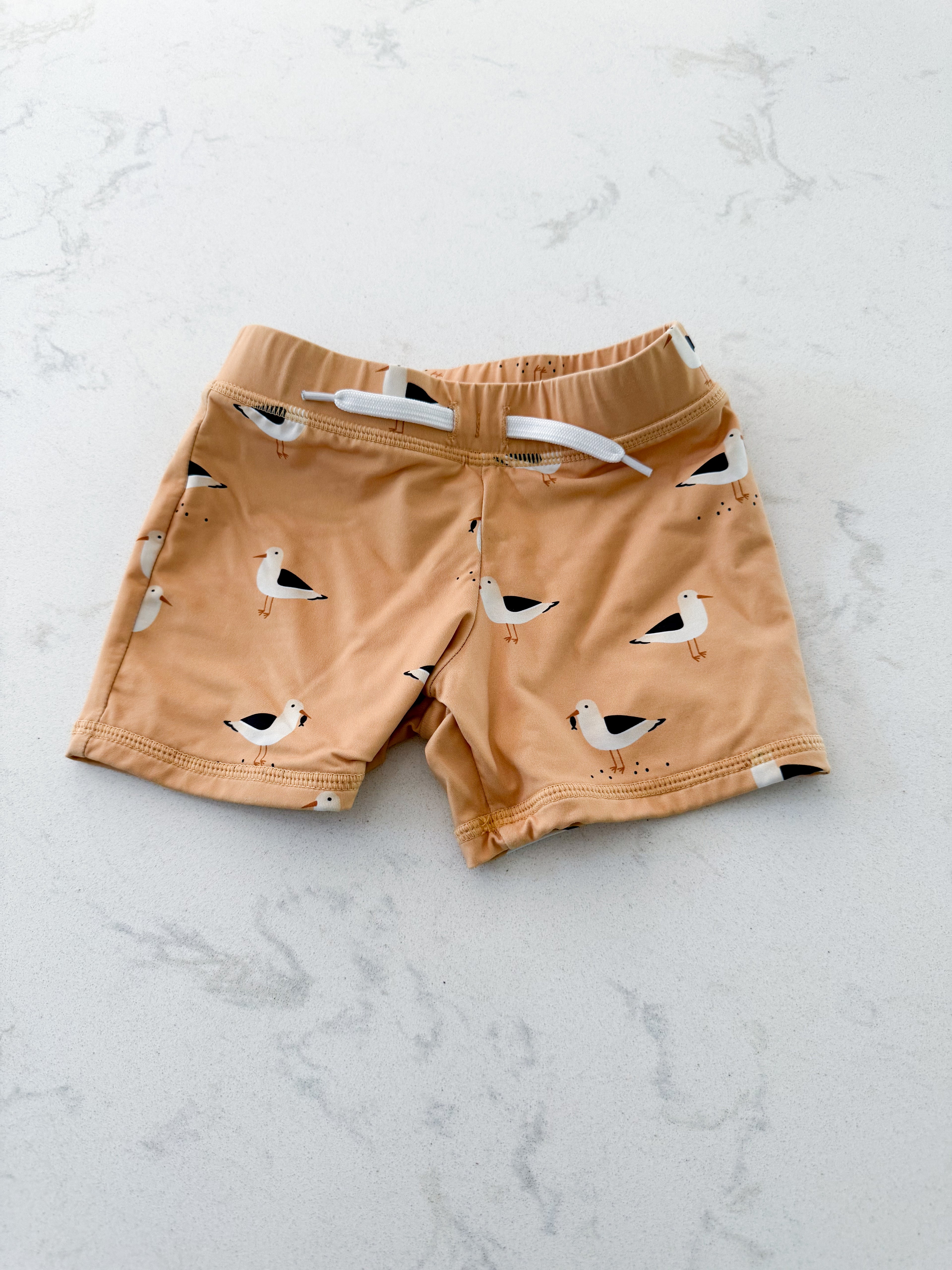 First by Petit Lem- 18-24m (fits tight)- VGUC- Sandy orange swim shorts with seagulls