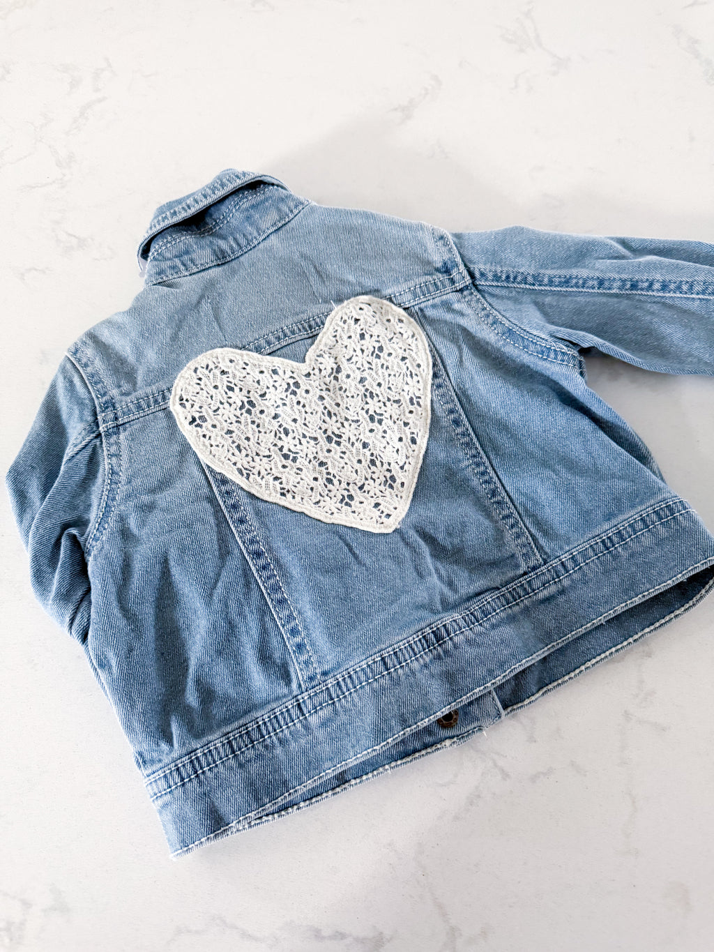 Joe Fresh- 18-24m- VGUC- light blue Jean jacket with lace heart on back